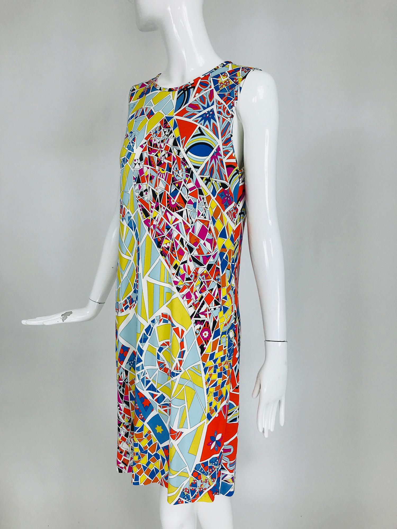 Emilio Pucci silk & rayon blend jersey, sleeveless star print shift dress marked size 42. Pull on sleeveless dress has a jewel neckline that closes at the back with a button and loop. Bold mosaic print in bright colours featuring stars. Perfect