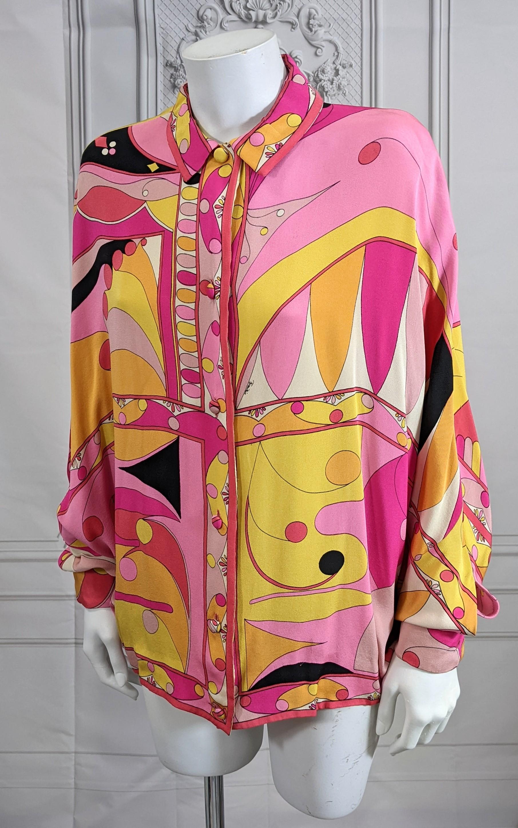 Unusual Emilio Pucci Print Bat Wing Blouse in heavy 3 ply silk crepe. All the amazing patterns are perfectly placed for effect. Blouse hits above hip and has no inset sleeves but is cut more like a kimono with gathered cuffs. There are buttonholes