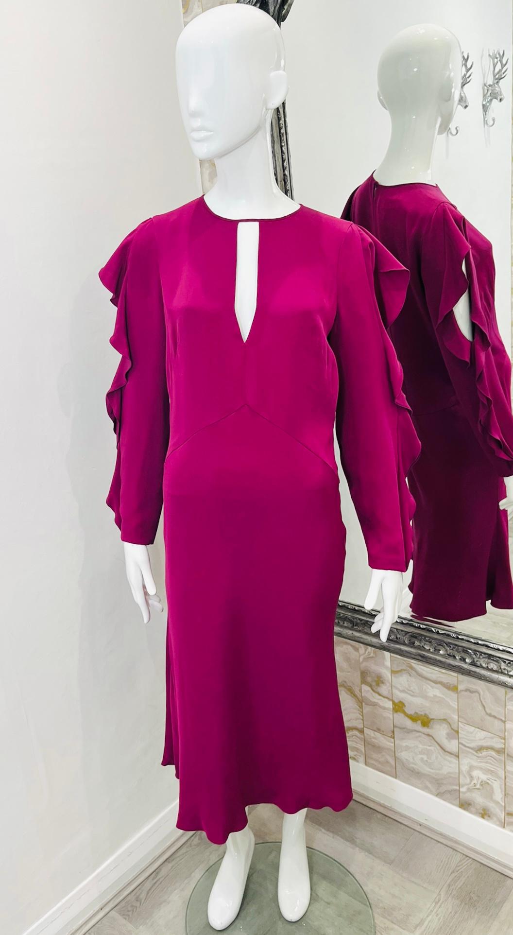Emilio Pucci Silk Frill Dress

Dark fuchsia midi dress with deep teardrop cut out to the neckline.

Long frill embellished split sleeves, concealed zip fastening at back.

Fully lined with silk.

Size – 46IT

Condition – Very Good

Composition –