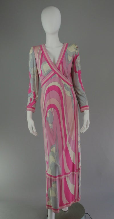 Emilio Pucci Silk Jersey V Plunge neckline Maxi Dress from the 1970s. This gorgeous gown is done in  hot pink, medium pink, pale pink, cream and two shades of gray swirled together in a vibrant print on fine silk jersey. The fitted deep V cross over