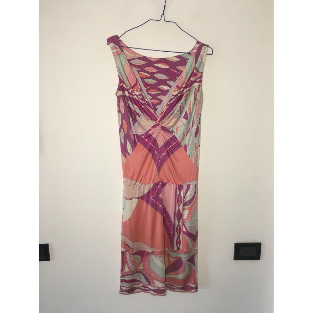 Emilio Pucci Silk Mid-Length Dress in Pink

Emilio Pucci dress. Crafted in beaded silk. Neckline on the back. 
 Size 40 it. It measures 33 cm at the shoulders, 40 cm at the bust, 105 cm in length. 
 It has some halos along the sleeves and abdomen