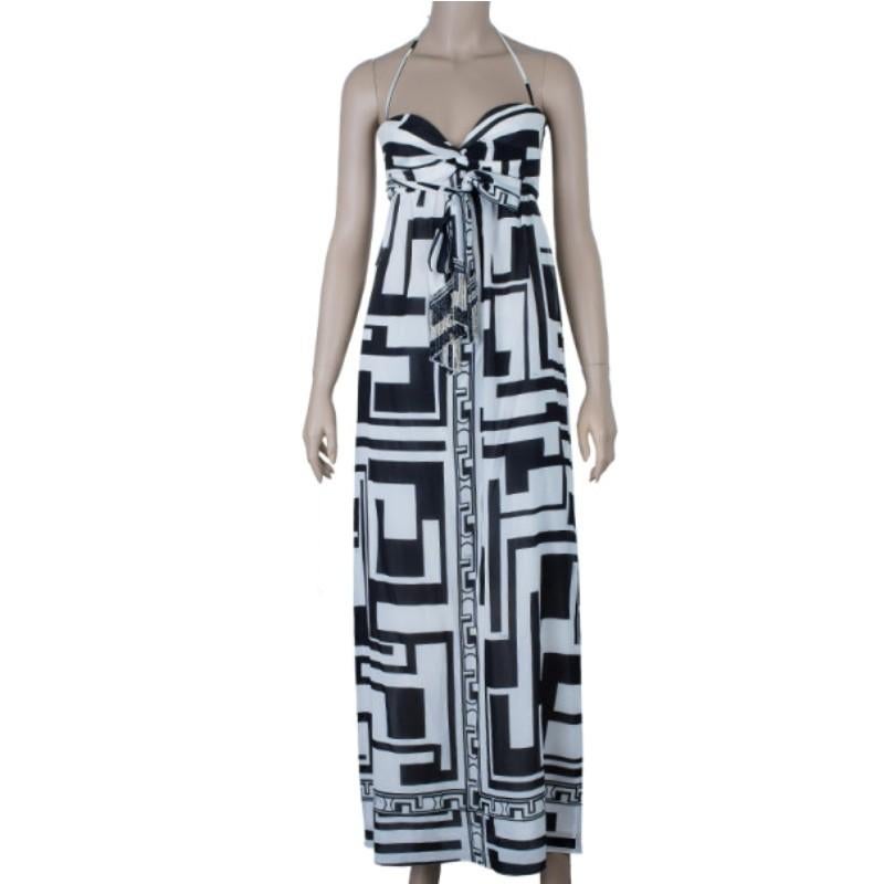 Made with a cotton and elastane blend, this Emilio Pucci dress embodies summer. Its smooth material is printed with geometric designs in black and white, reminding us of Ancient Greek fashion. It features a ruched bow-like bust with string straps
