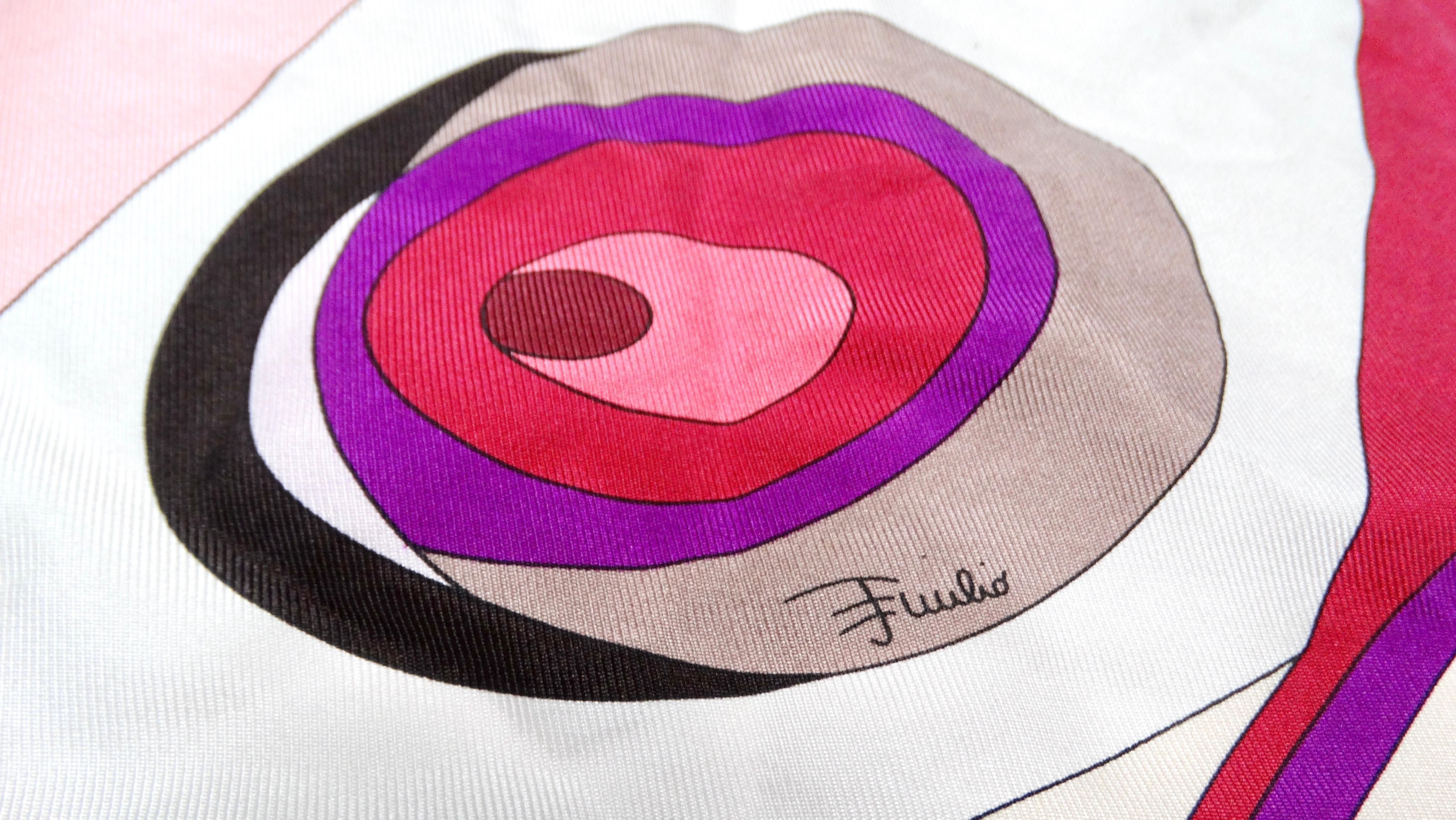 Step into a world of vibrant style with this Emilio Pucci Vintage Silk Pink & Purple Abstract Printed Scarf, a quintessential piece that embodies the essence of 1960s and 1970s fashion. Renowned for its bold, kaleidoscopic patterns, this scarf