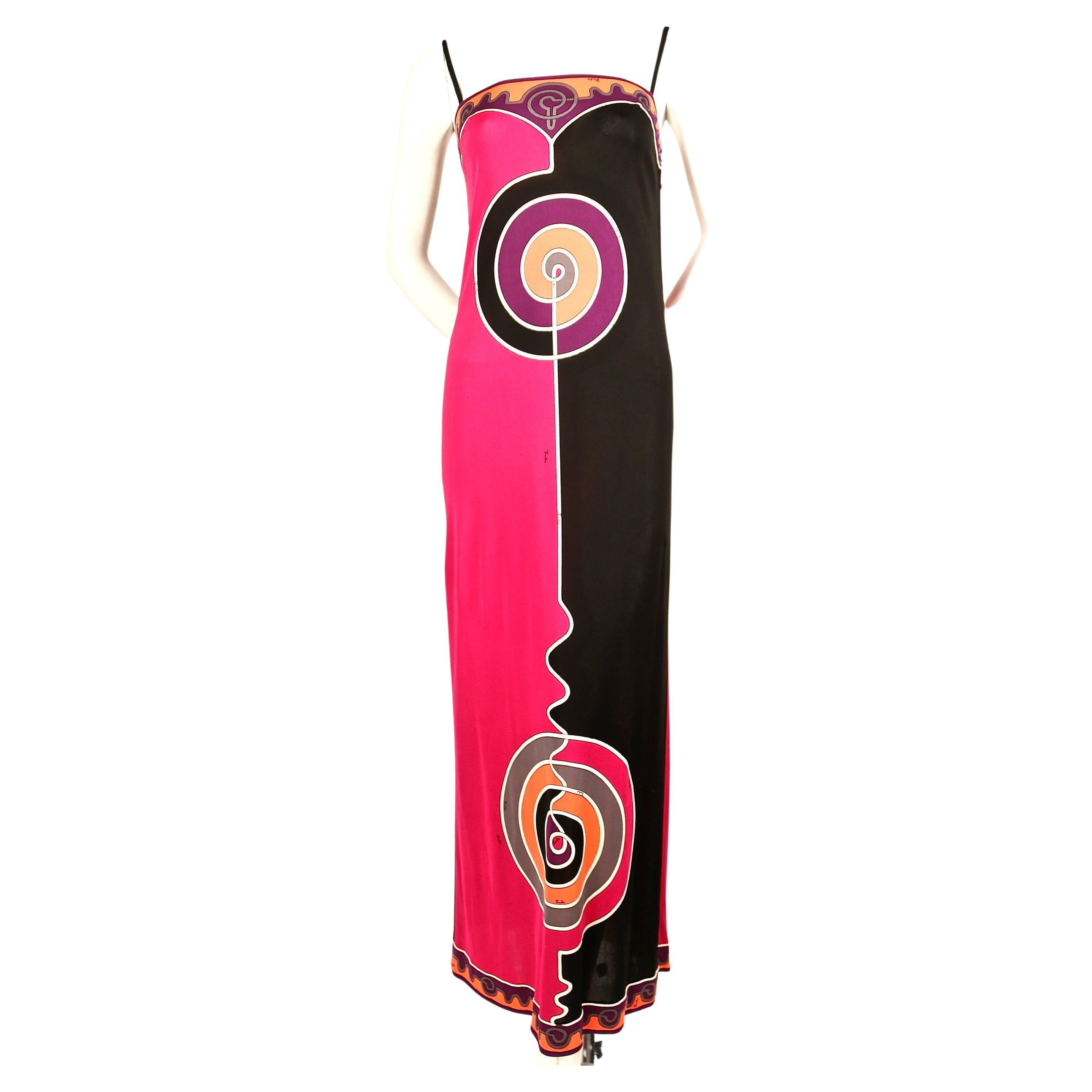 Exceptional, vivid, printed silk jersey spaghetti strap dress from Emilio Pucci dating to the late 1960’s, early 1970's. Labeled a size 6 however this would best fit a modern size 2. Approximate measurements: bust 31.5-32