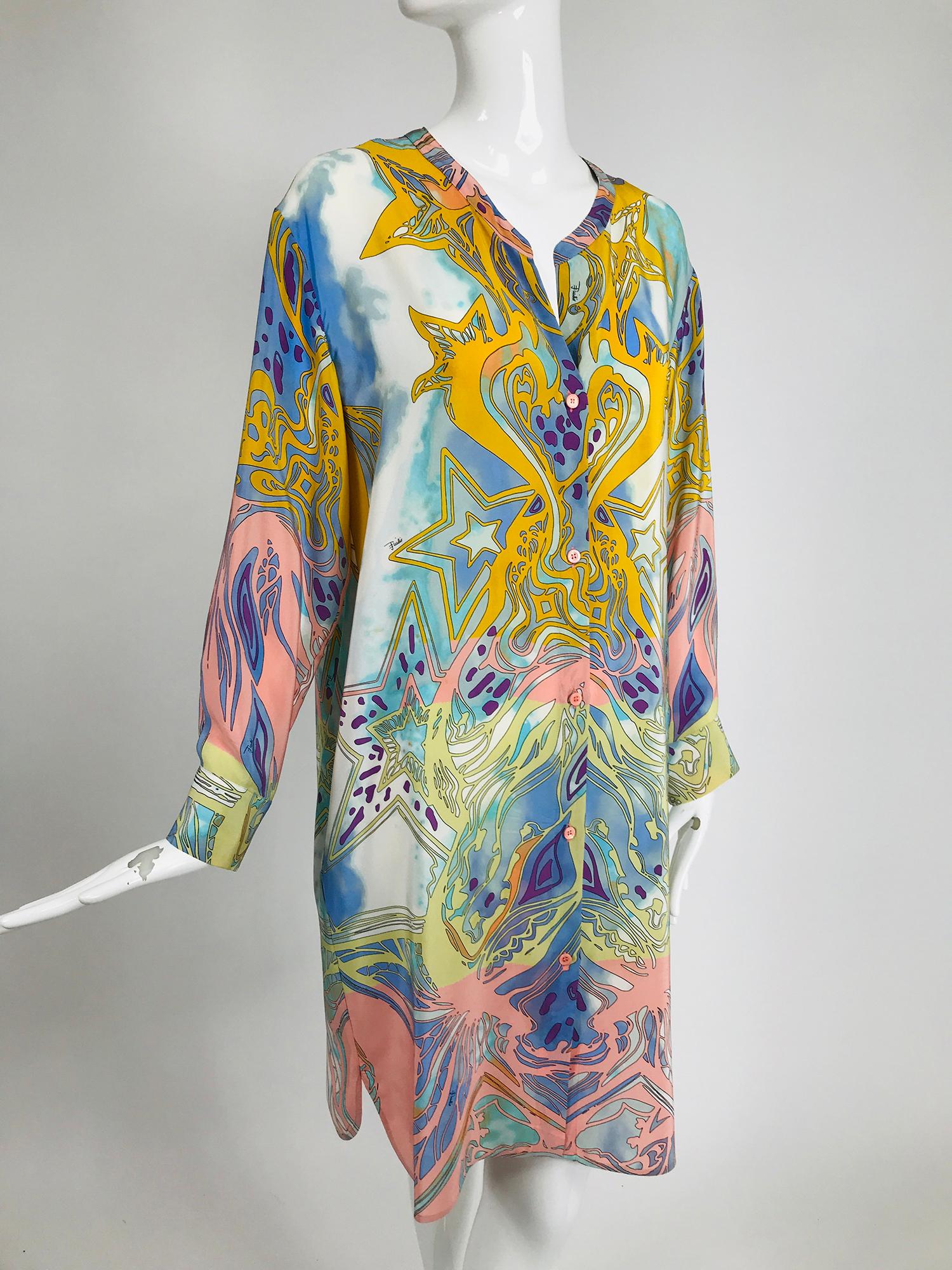 Emilio Pucci silk star print button front, long sleeve dress or cover up. Banded V neckline, long sleeves with button cuffs. The dress closes with buttons at the front, shirt tail hem. Pastel print with tie dye and stars. Unlined. Marked size 40.