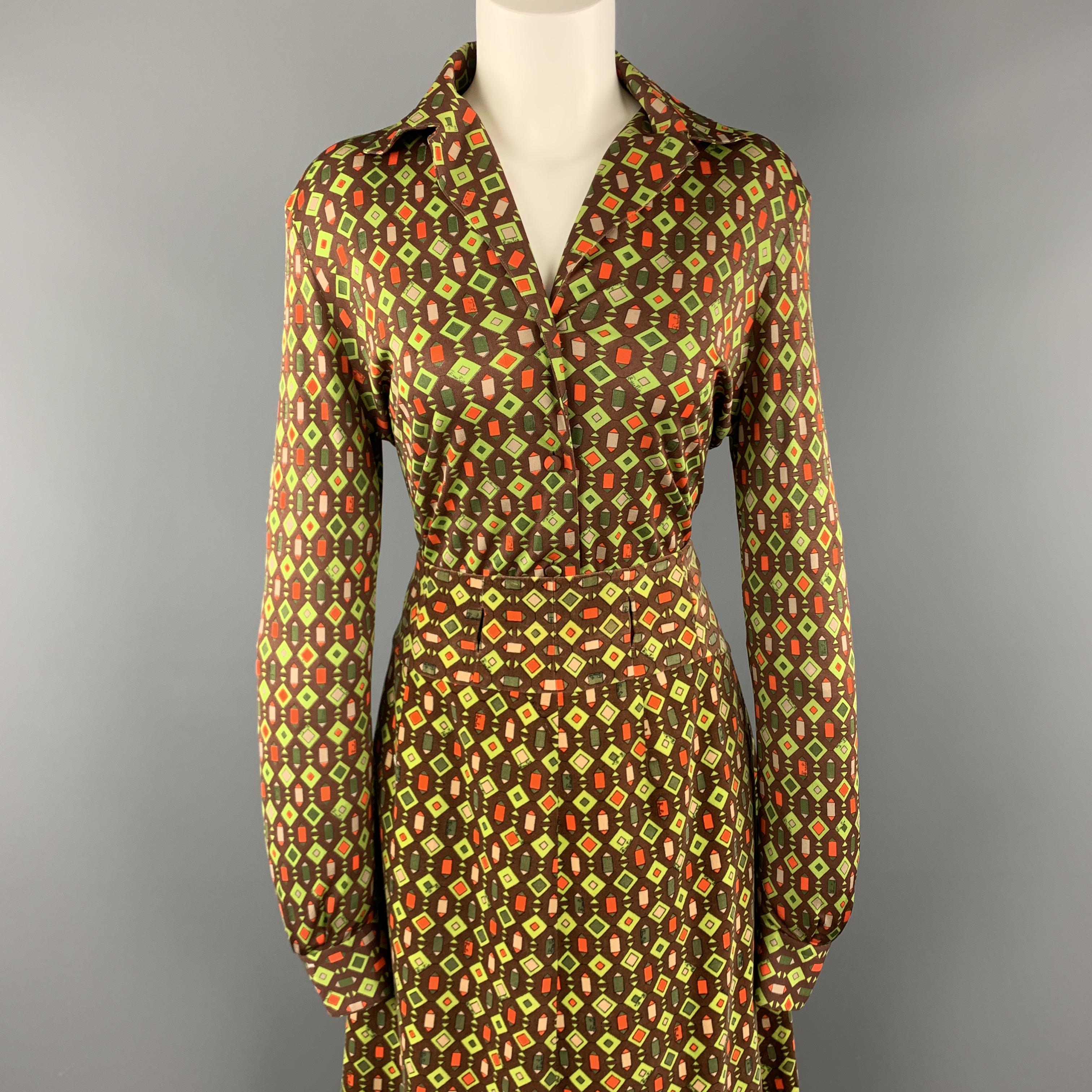 Vintage EMILIO PUCCI ensemble comes in a green and brown geometric print and includes a silk blend long sleeve blouse and matching full length velvet A line skirt with belt slits. Made in Italy.

Very Good Pre-Owned Condition.
Marked: