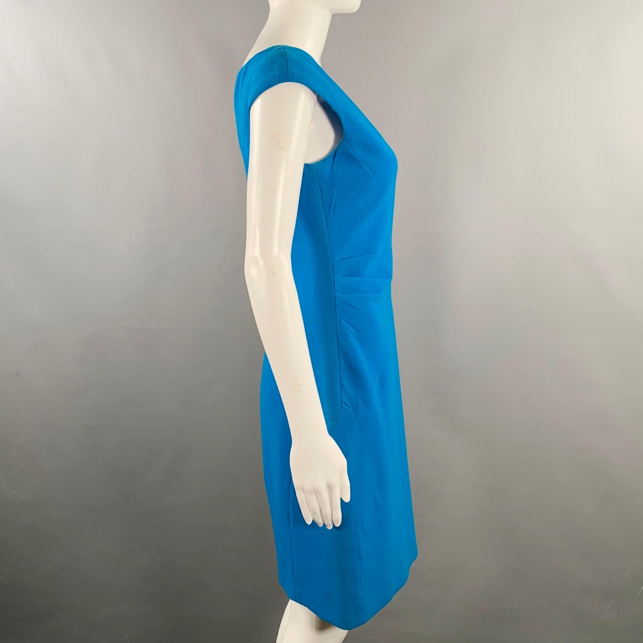 EMILIO PUCCI cocktail dress
in a blue virgin wool blend crepe featuring a sleeveless style, pleated side details, and side zipper closure. Made in Italy.Excellent Pre-Owned Condition. 

Marked:   IT 42 

Measurements: 
 
Shoulder: 17.5 inches Bust: