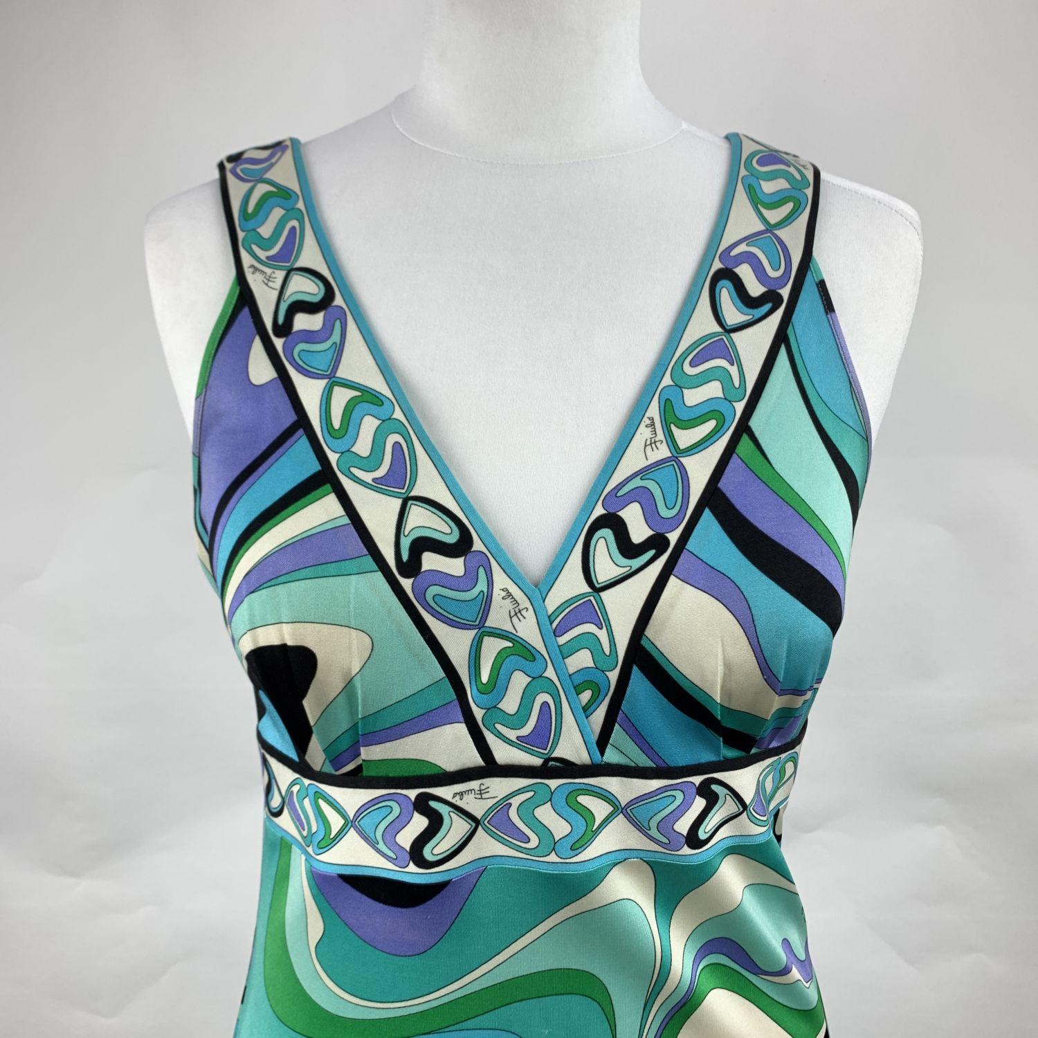Beautiful Emilio Pucci sleeveless dress. Iconic print in turquoise colorway. The dress is made of a lightweight silk jersey. V-neckline. Composition: 100% Silk. Unlined. Size:  42 IT, 38 F, 8 USA, 10 UK, 38 D (The size shown for this item is the