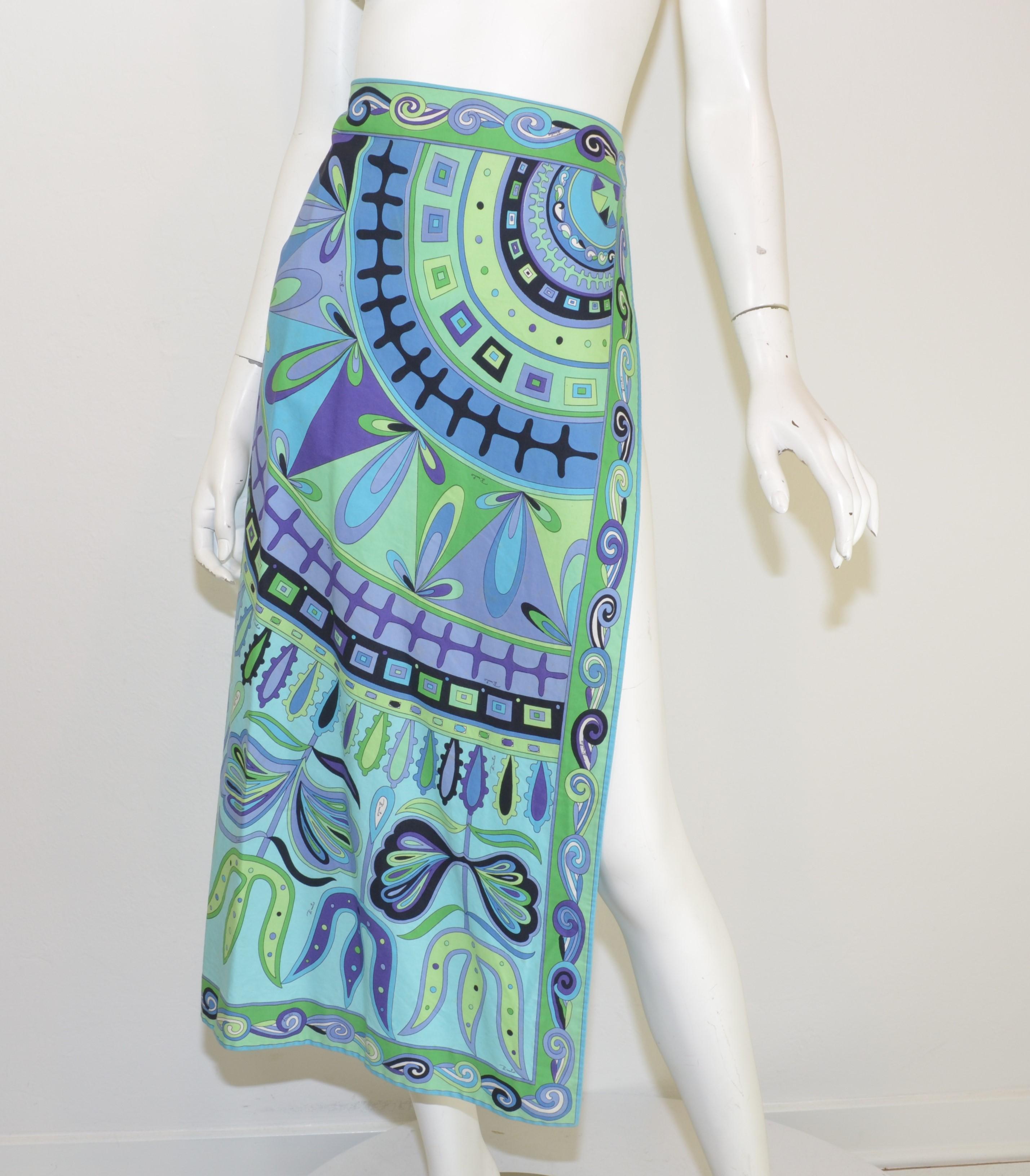 Emilio Pucci Vintage Skirt is featured in a beautiful print in blue, green, and purple hues. Skirt has a high slit along the left thigh and hook-and-eye closures. Labeled size 8, made in Italy.

Measurements:
Waist 28”
Hips 30”
Length 35”