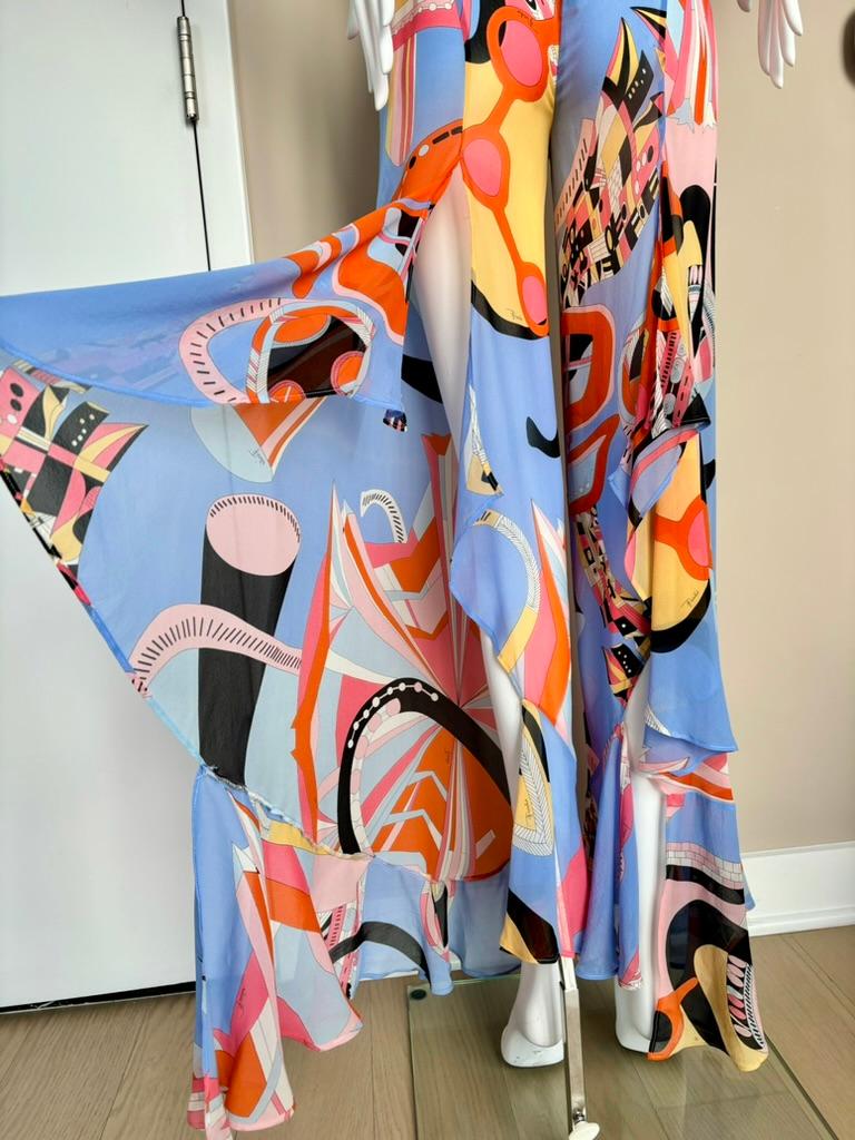 Emilio Pucci

Vintage

100% Silk

Semi Sheer

Huge slit in the back of each pant leg

Ruffles

Pants IT40 - Top One Size

Fits like an XS this ensemble

Pristine

Measurements in inches laying flat:

TOP: 19 from the neck down, 42 widest