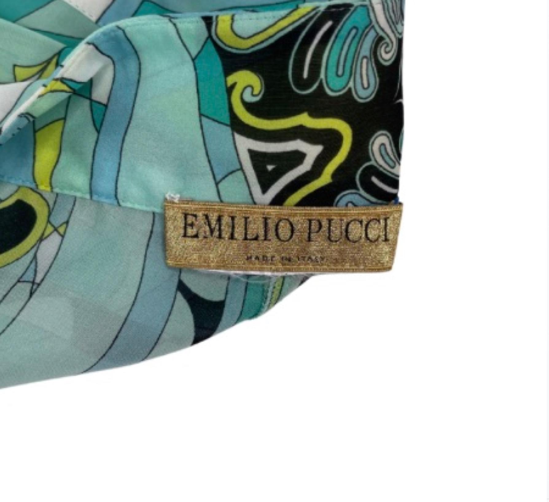 For sophisticated style with impact, turn to Emilio Pucci. This elegant cover up short is semi-sheer featuring a signature Pucci pattern with gold hardware. 

COLOR: Blue, green, multi-coloured. 
MATERIAL: Silk
SIZE: 38 IT
CONDITION: Good vintage
