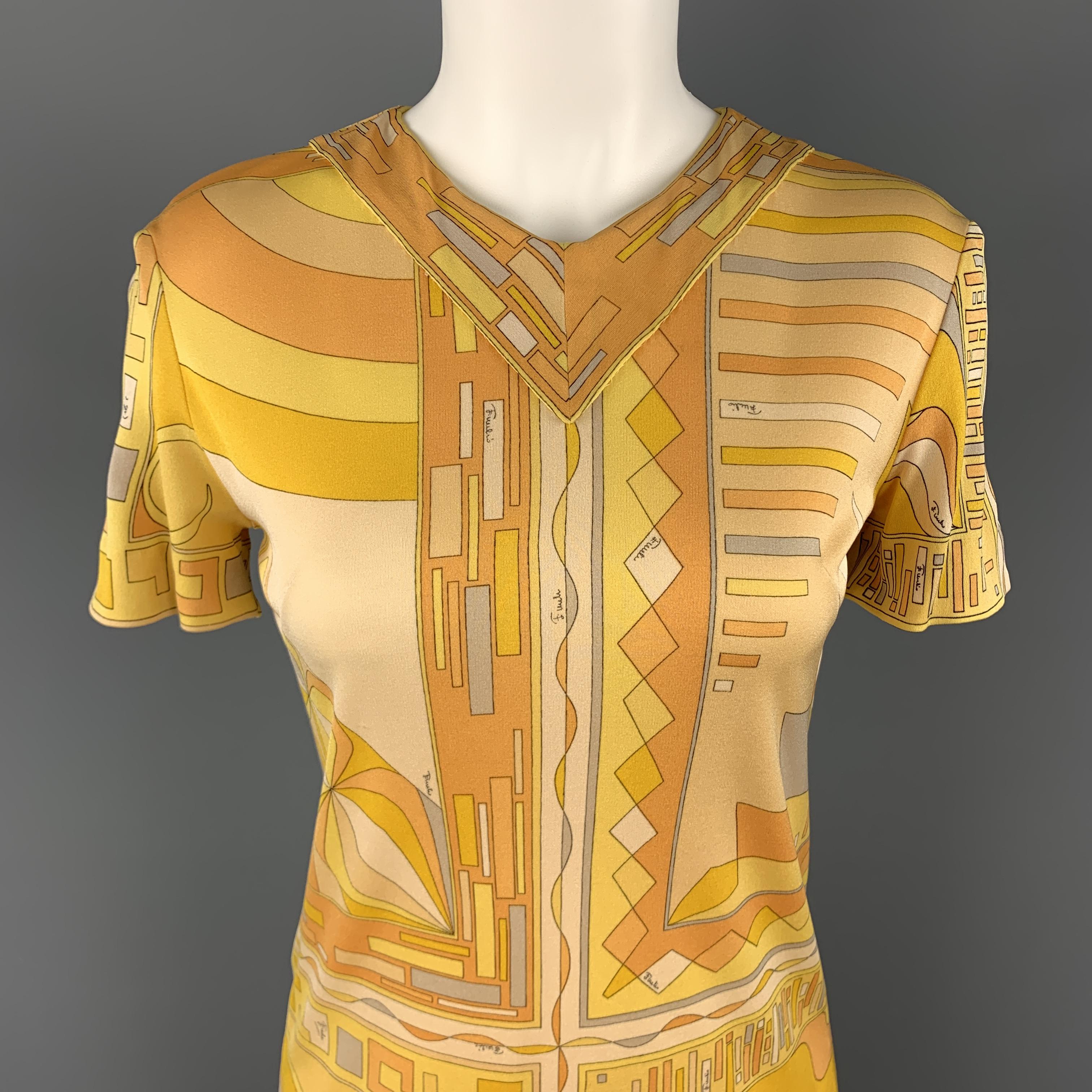 Vintage EMILIO PUCCI shift dress comes in light weight silk jersey with a V neck, short sleeves, and al over signature print. Made in Italy.

Very Good Pre-Owned Condition.
Marked: 6

Measurements:

Shoulder: 16 in.
Bust: 35 in.
Waist: 32 in.
Hip: