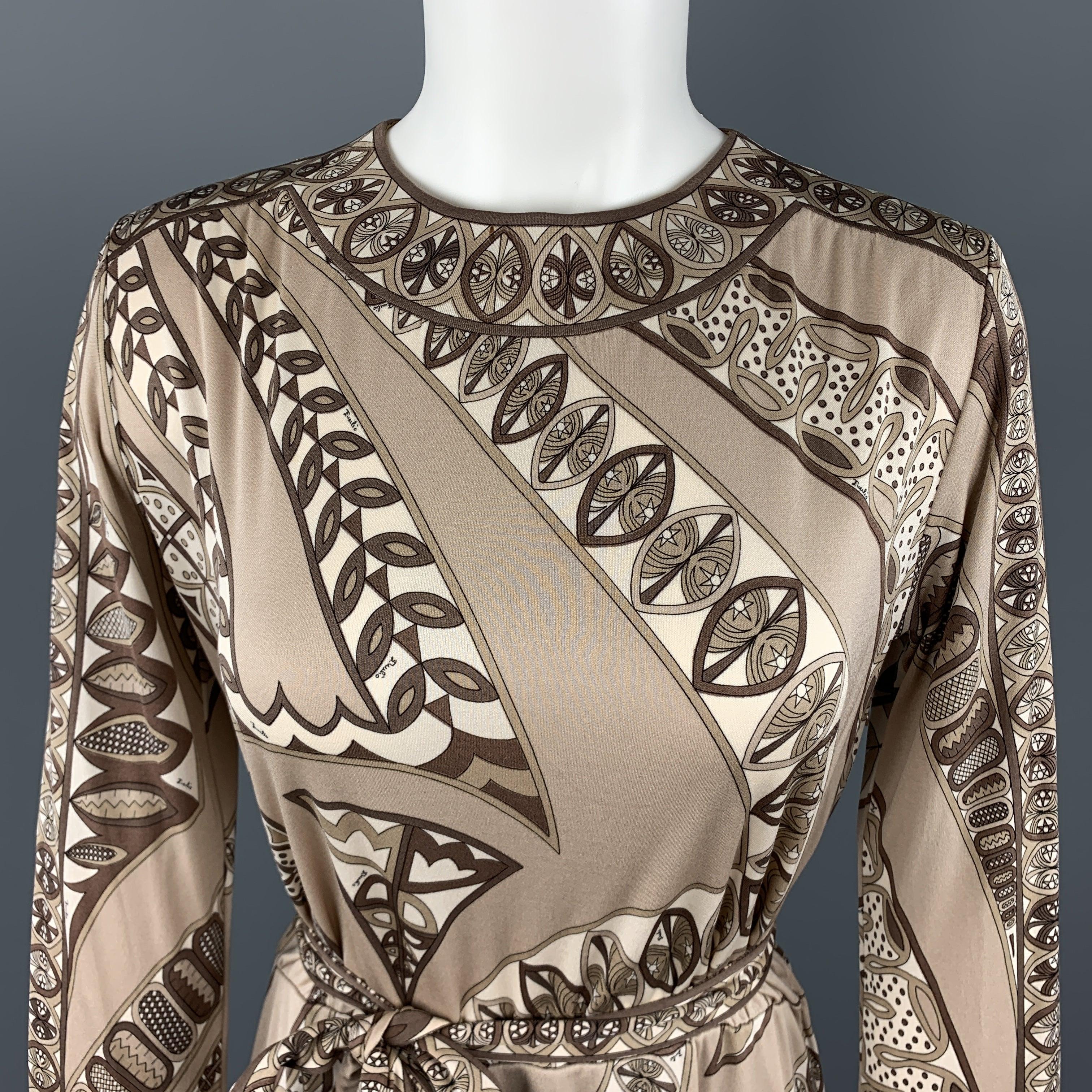 Vintage EMILIO PUCCI shift dress comes in taupe print silk jersey with a round neckline, tied belt waist, long blouse sleeves, and A line skirt. Wear and marks throughout. As-is. Made in Italy.Fair
Pre-Owned Condition. 

Marked:   8 

Measurements: