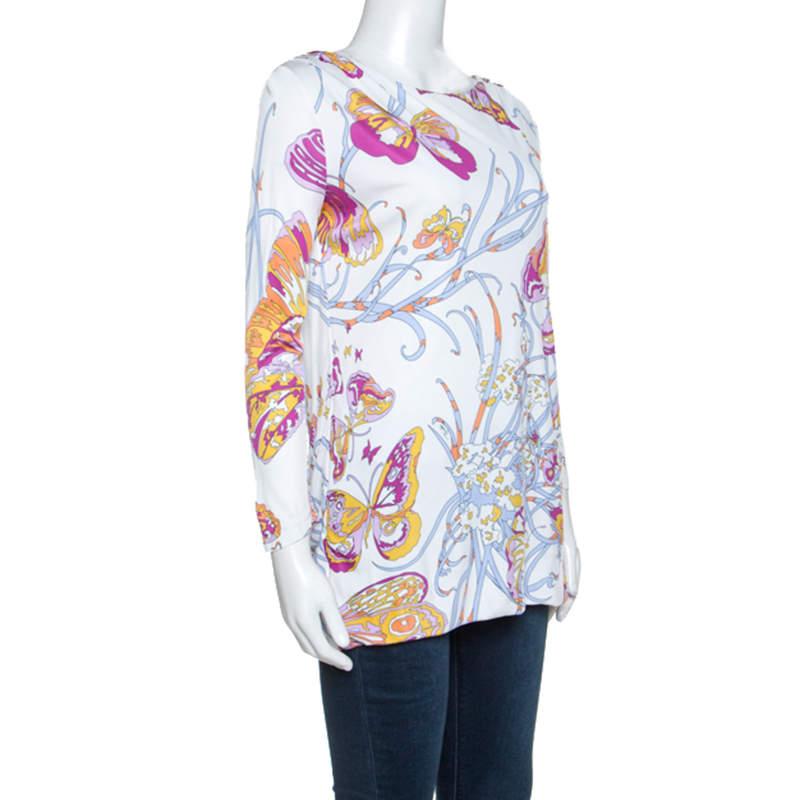 From Emilio Pucci, this is an awesome top for you to show off your style. This tunic top features a stunning butterfly print throughout, has long sleeves, round neck and a comfortable fit. Pair it with high-waisted bottoms and gold accessories for a