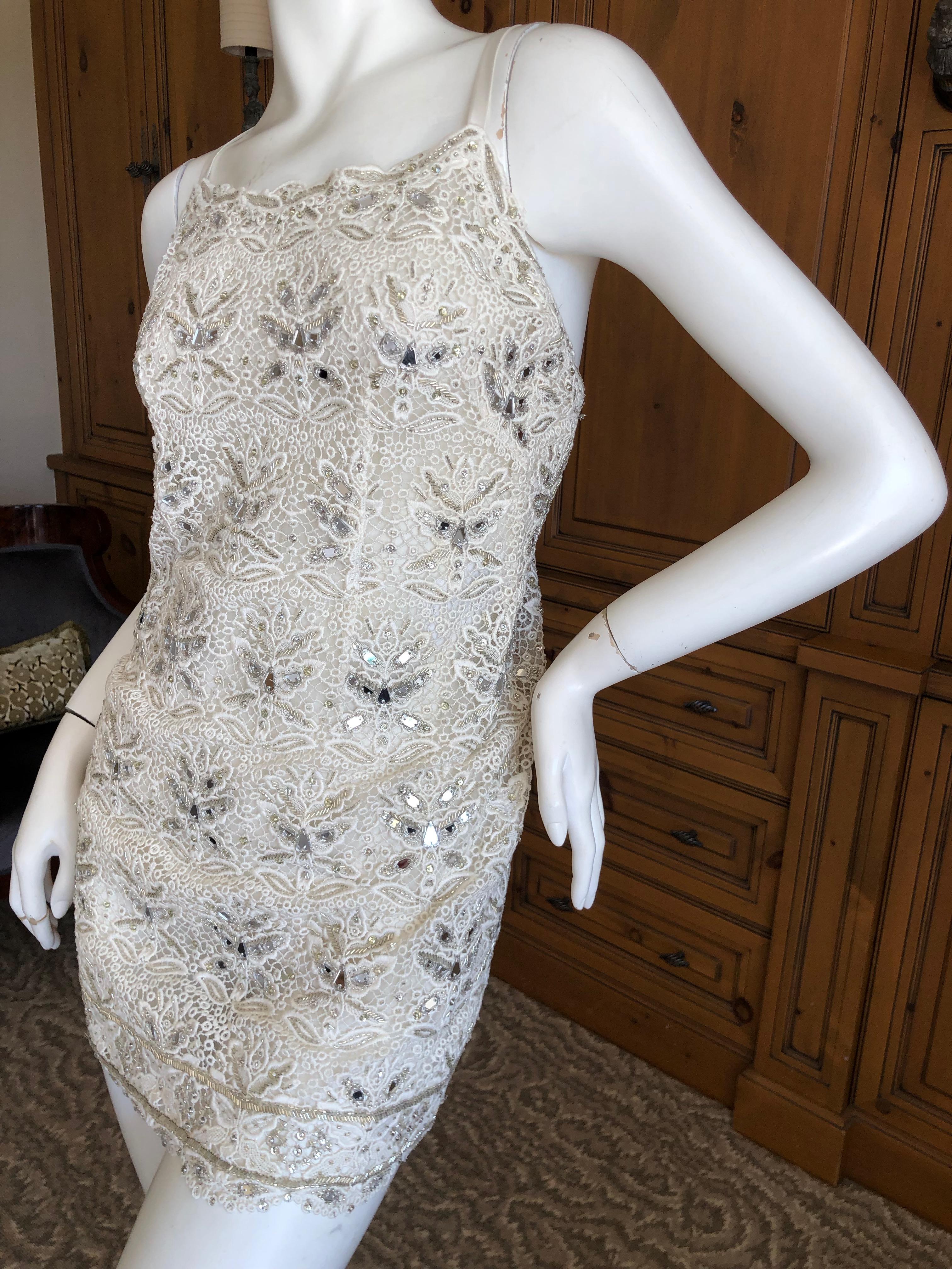 Emilio Pucci White Lace Micro Mini Dress with Mirror and Bead Embellishment
WOW , this is so fun. Please use zoom to see the details.
Size 34 FR 4 US
Bust  35