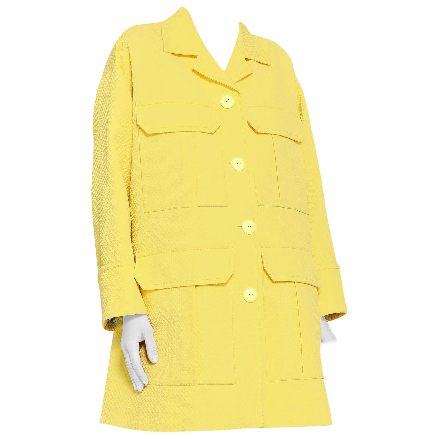 Emilio Pucci yellow matelasse oversized coat

- Canary-yellow, heavyweight matelasse
- Notch lapel, long sleeves, oversized turn-up cuffs 
- Four oversized decorative flap pockets
- Centre-front button fastening, yellow lacquered metal buttons, grey