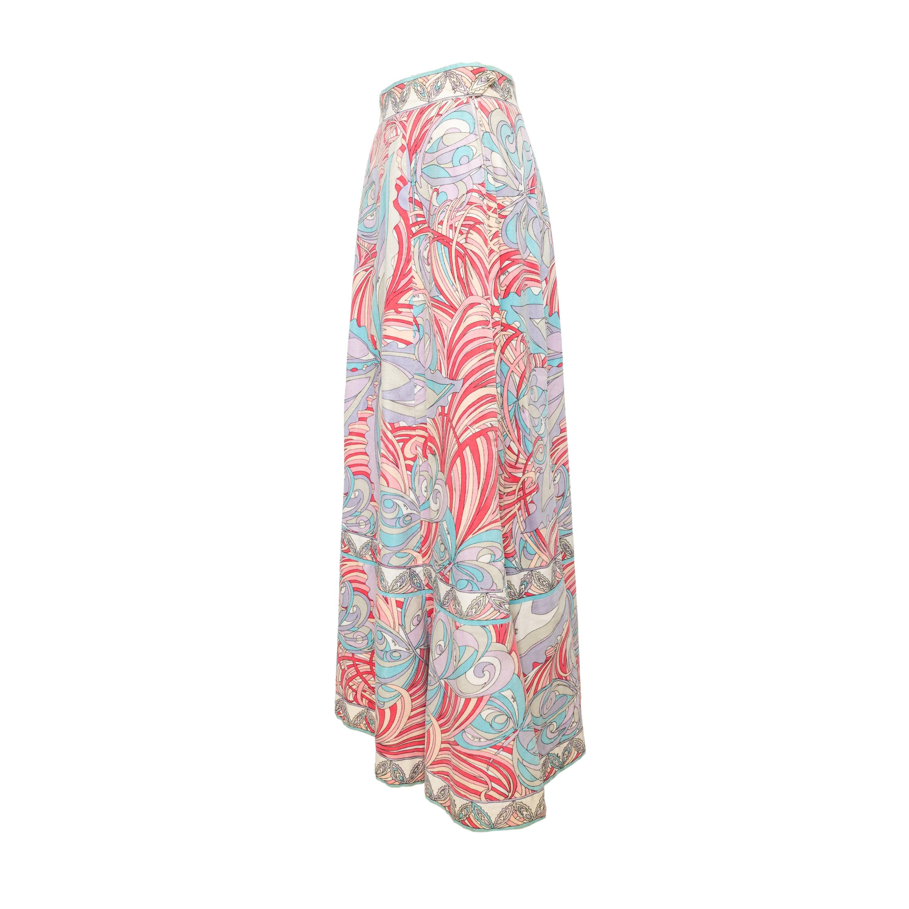 Elegant and vibrant, the Emillio Pucci Long Skirt makes a bold statement with its abstract multicolor print. The velvet fabric adds luxurious texture while the long and full silhouette creates a flowing and flattering look. Complete with a pink