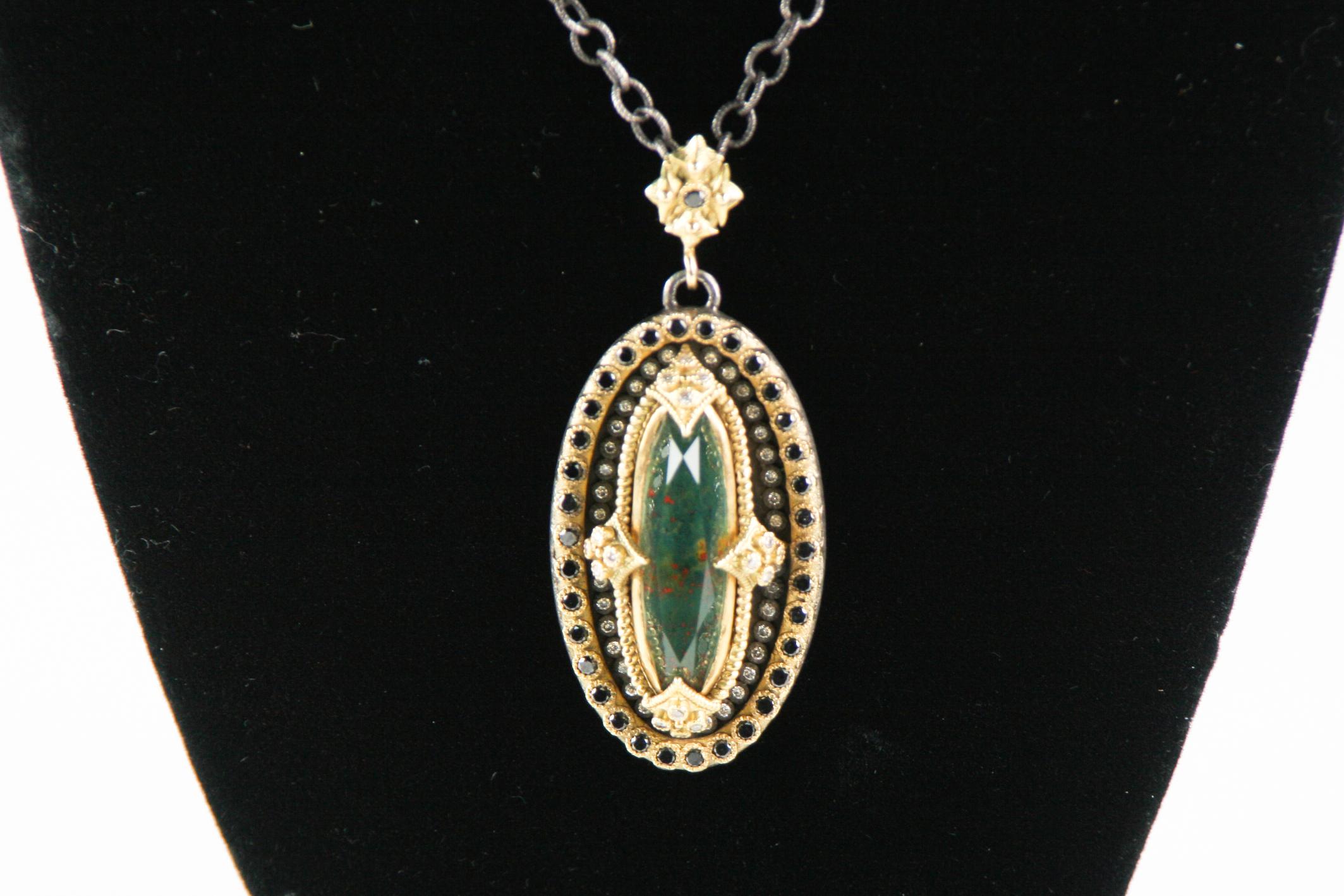 Beautiful 18k Yellow Gold and Oxidized Sterling Silver Pendant from Texan Jewelry Designer Emily Armenta
Pendant Features a Bloodstone Covered by a Faceted Quartz Set in an 18k Yellow Gold, Sterling Silver, and White & Black Diamond Bezel
Pendant