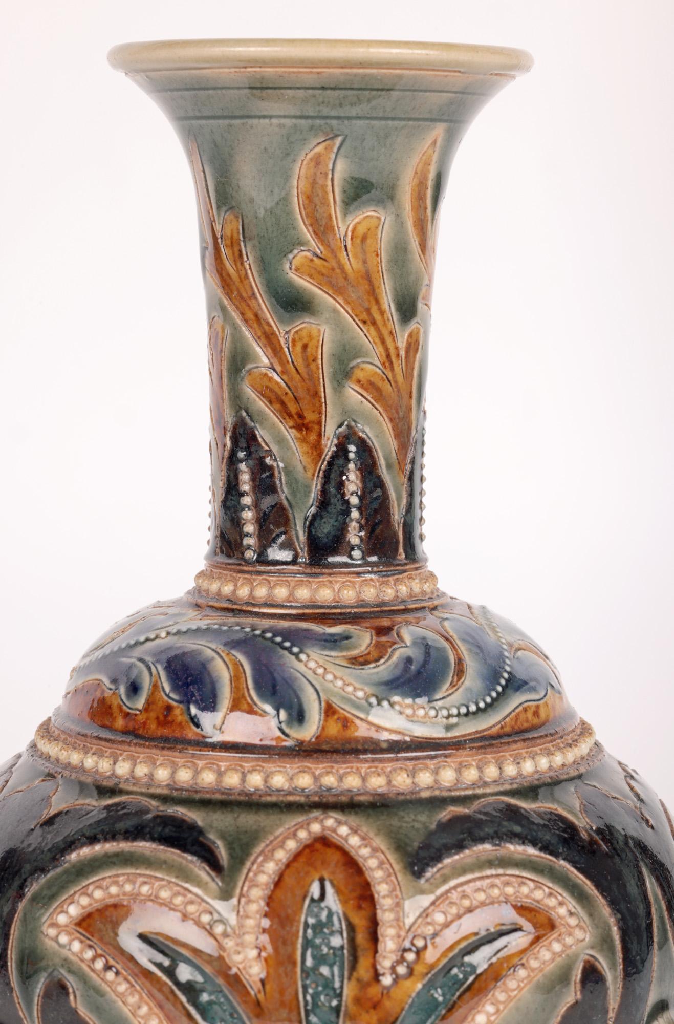 A rare and very stylish Doulton Lambeth Aesthetic Movement Art Pottery vase mounted on three owls by renowned artist Emily E Stormer dated 1880. This unusual stoneware vase stands raised on a flat round base with a raised curved edge and incised