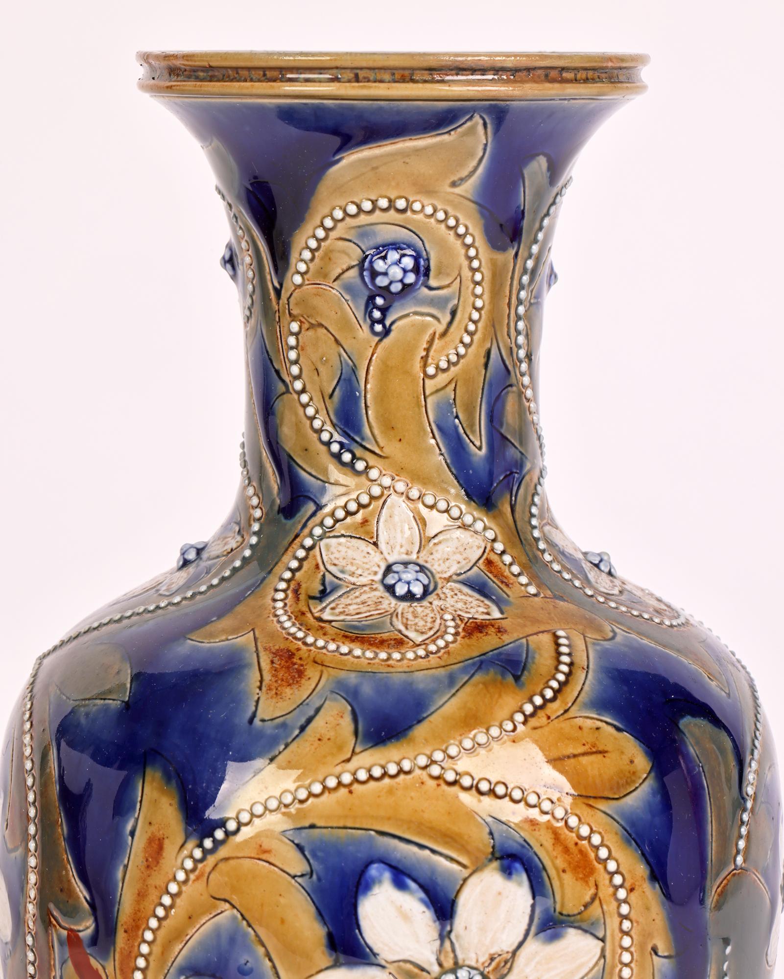 A rare and important Doulton Lambeth Aesthetic Movement trailing floral design vase by renowned and sought-after designer Emily J Edwards dated 1875. 

Emily Edwards was one of the first women designers and decorators at the Lambeth Studios and