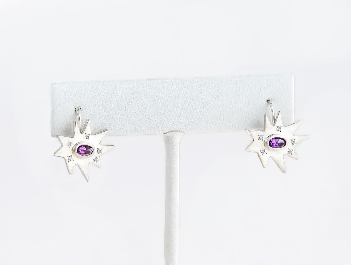 The perfect drop for any occasion. Our iconic matte sterling silver Stellina star is fixed to a lever back hook. Featuring our signature diamond dusting and a vibrant amethyst center, this pair is full of sparkle and color.
 
Matte sterling silver,