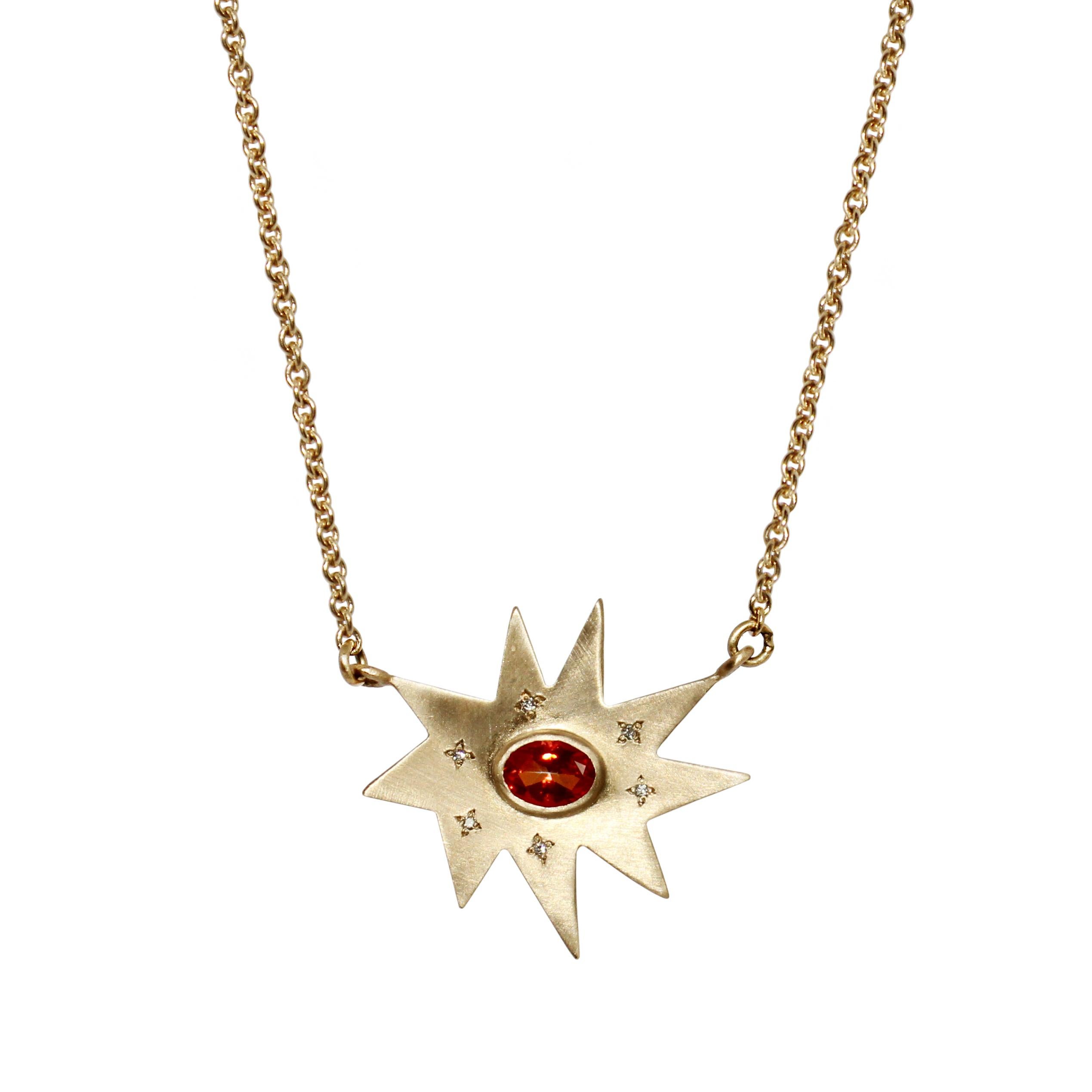 Classic and stunning. Our iconic matte gold organic star shape Stella necklace features our signature diamond dusting and a vibrant poppy passion topaz center. Hanging on a substantial gold chain, this colorful piece is luxe and weighty. Perfect to