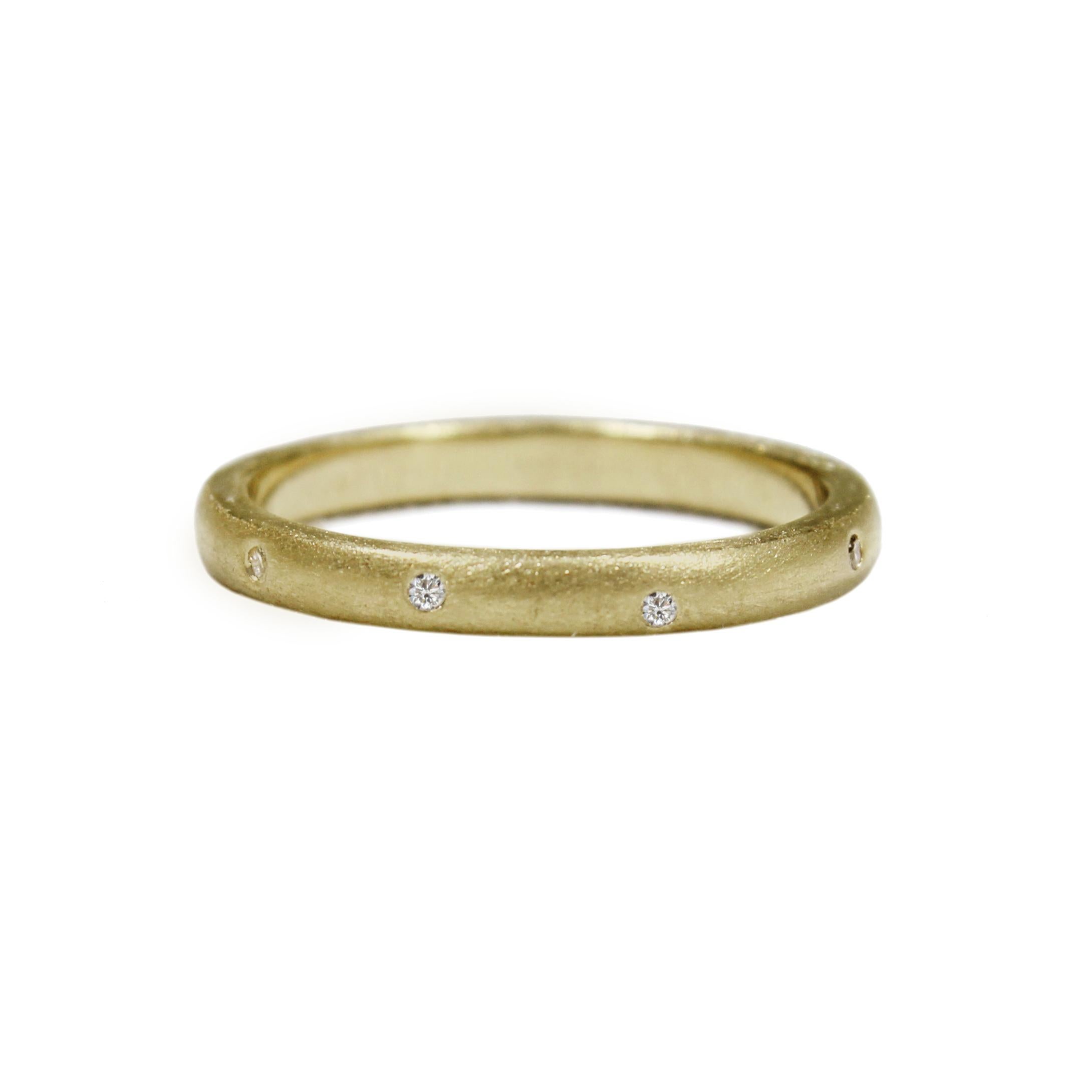 Leader of the stack! The ring you've been waiting for -- our simple stacking ring with 9 irregularly sprinkled little diamonds in matte 14k gold. Stunning on its own or as one of the pack (stack)! This ring works beautifully as a wedding band, as an