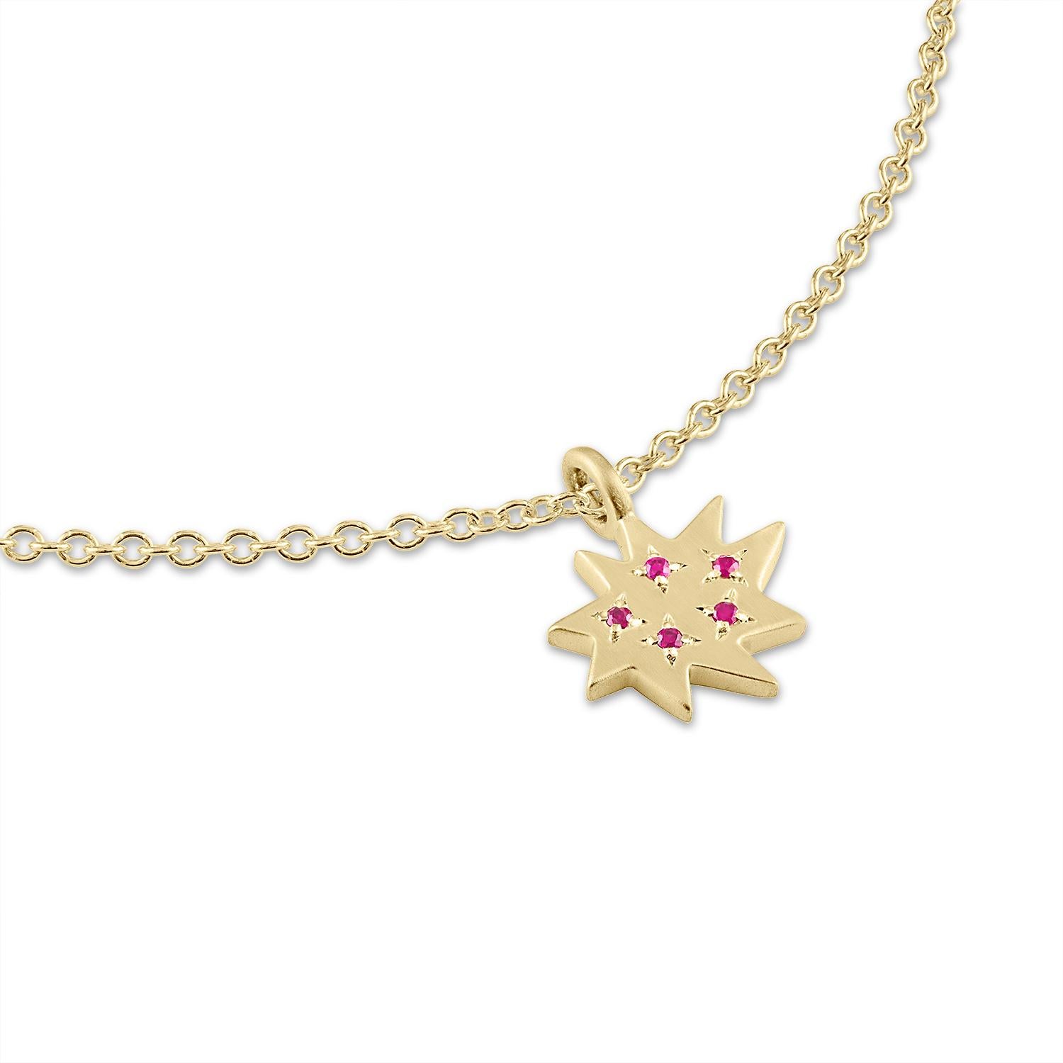 Elegant and adorable! Our Mini Stella Necklace is the perfect piece to layer or wear alone. Our iconic 14k gold organic star in a new delicate size hangs on a 14k gold chain and sparkles with five gorgeous little rubies. 

KAPOW! The Stella