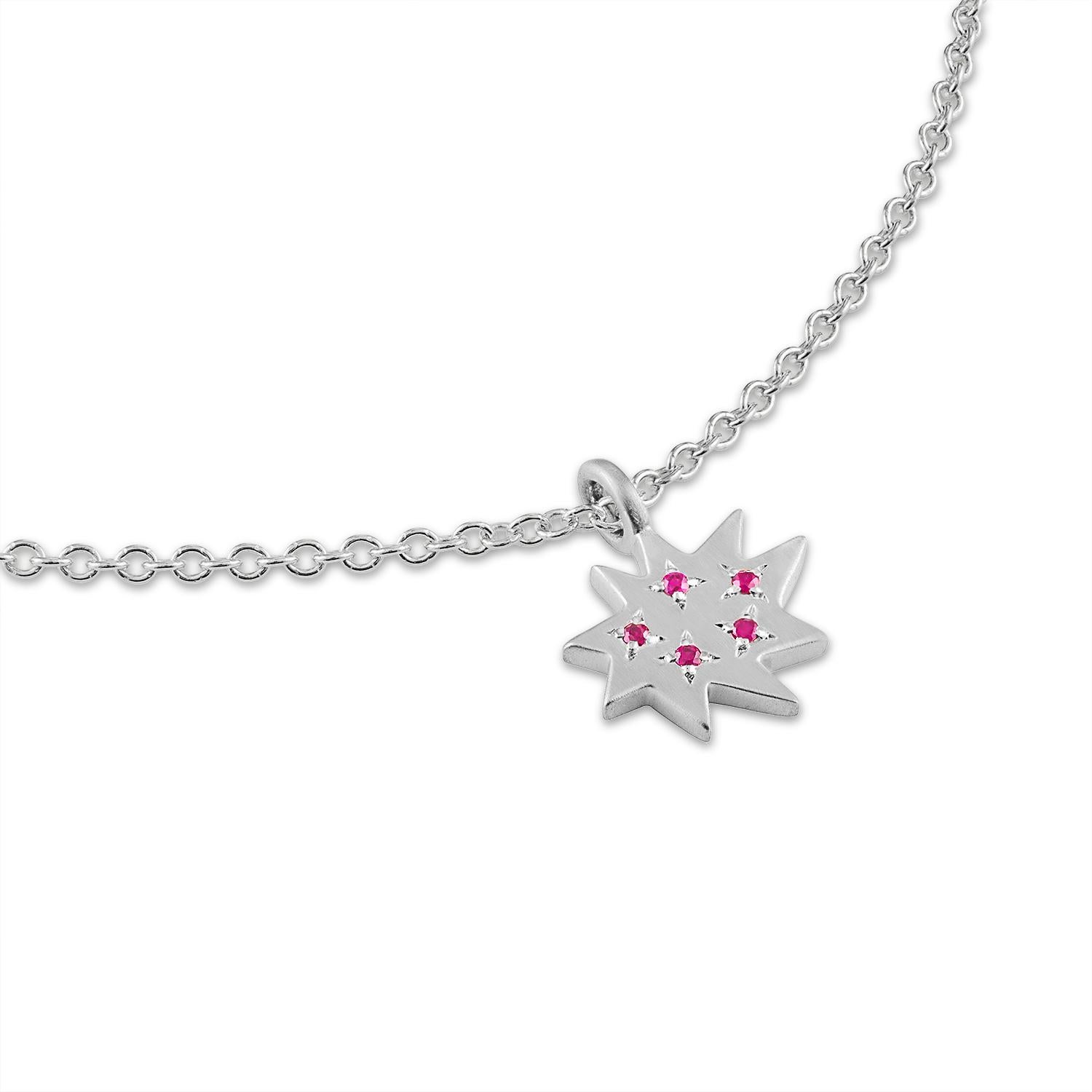 Elegant and adorable! Our Mini Stella Necklace is the perfect piece to layer or wear alone. Our iconic  organic star in the very popular mini size hangs on a sterling silver gold and sparkles with five gorgeous little rubies. 

And now through the