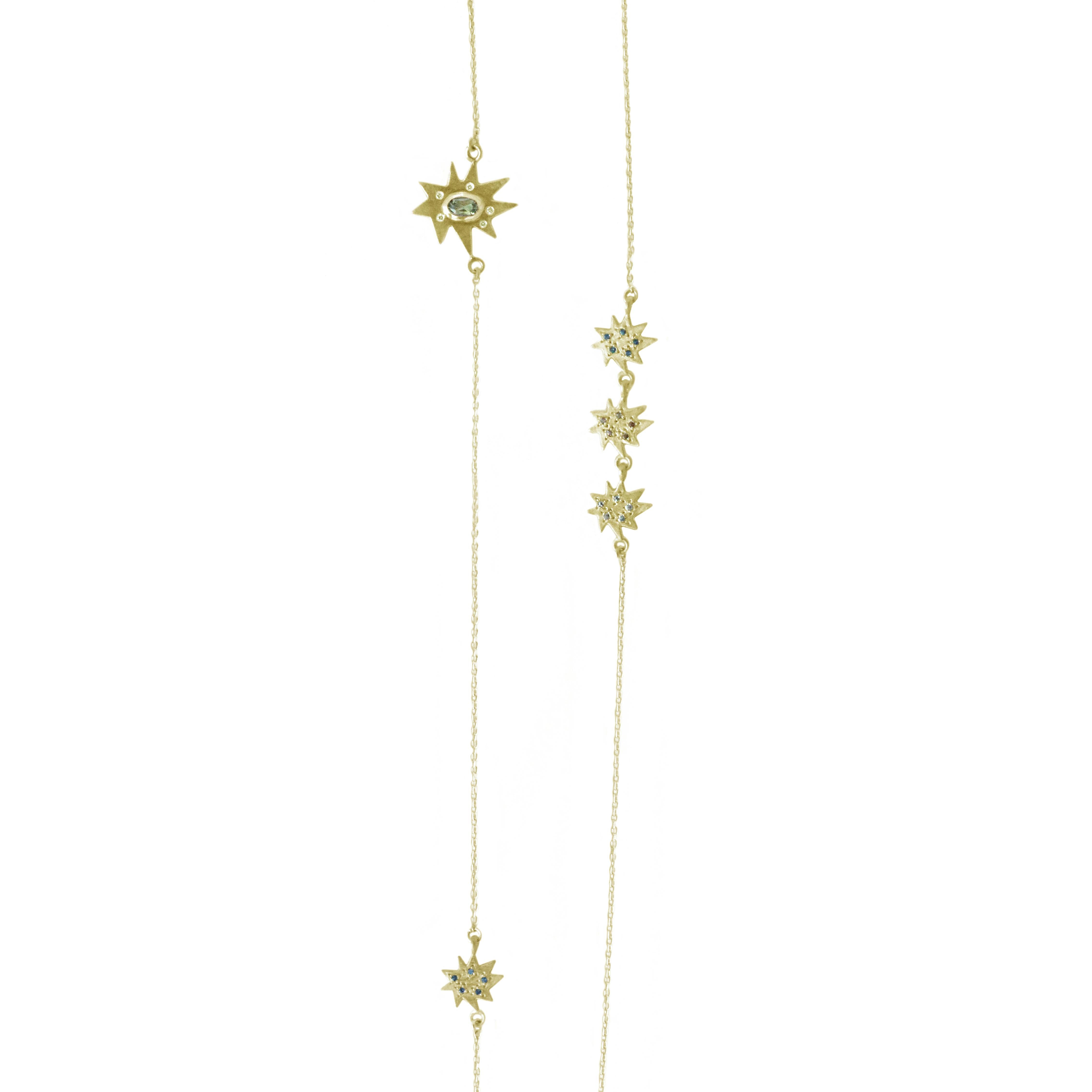 Go long or go home! Our Stella Mixed Element Station Necklace is another one that's fabulous on its own, or as a most versatile layering piece. 14k matte yellow gold: one Stellina, four Mini Stella stars and two bezel set stones make this piece an