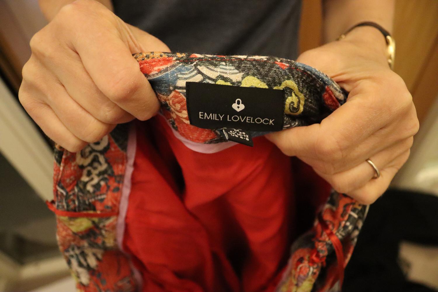A fun evening skirt by Emily Lovelock.  The skirt has a wonderful print of animals and flowers, with gold thread detail. It has a side zip opening and self fabric belt. The skirt is partly lined. 
Size M , UK 10 /12. Measurements: Waist up to 29'',