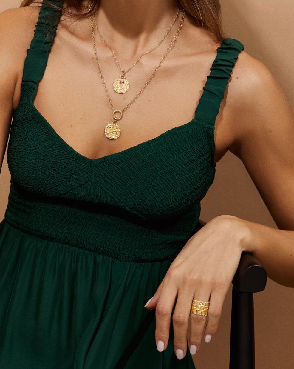 kaitlan collins necklace medallion meaning