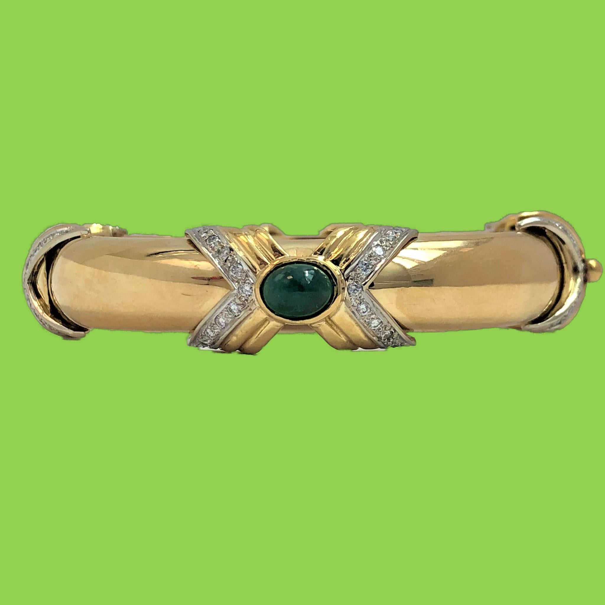 Made by Emis Beros, this tailored, 18K Yellow Gold bangle sports four chevron 
stations, set with 76 round brilliant cut diamonds weighing an approximate total of 1.00CT of overall G Color and VS2 Clarity. Two of the four stations are also bezel