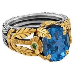 Anello da cocktail in oro 18 carati e argento con topazio blu da 8k, diamanti e tsavorite di Emma Chapman