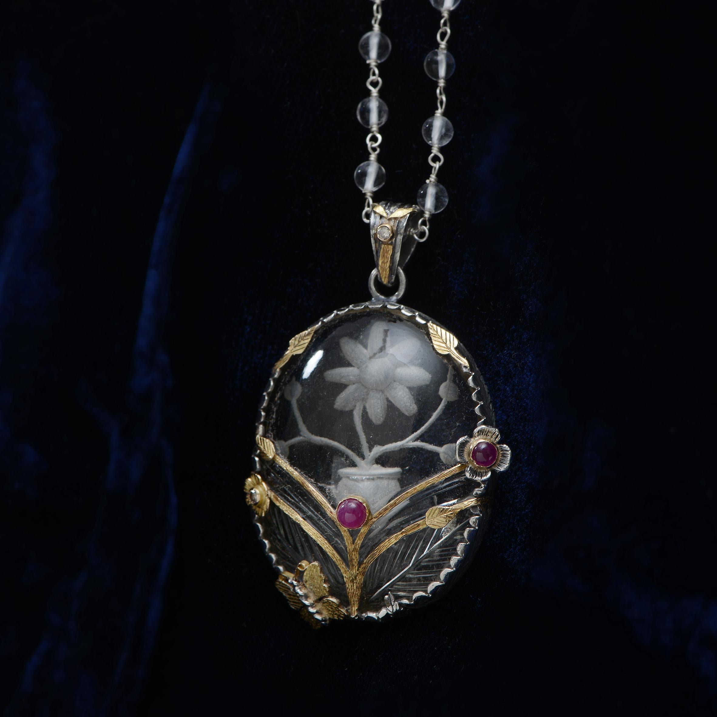 
 This stunning one of a kind Crystal Ruby Diamond 18 Karat Gold Silver Statement Pendant, has been handmade in our workshops. It features a large hand etched crystal, which has hand engraved 18 karat gold and oxidized sterling silver floral motifs