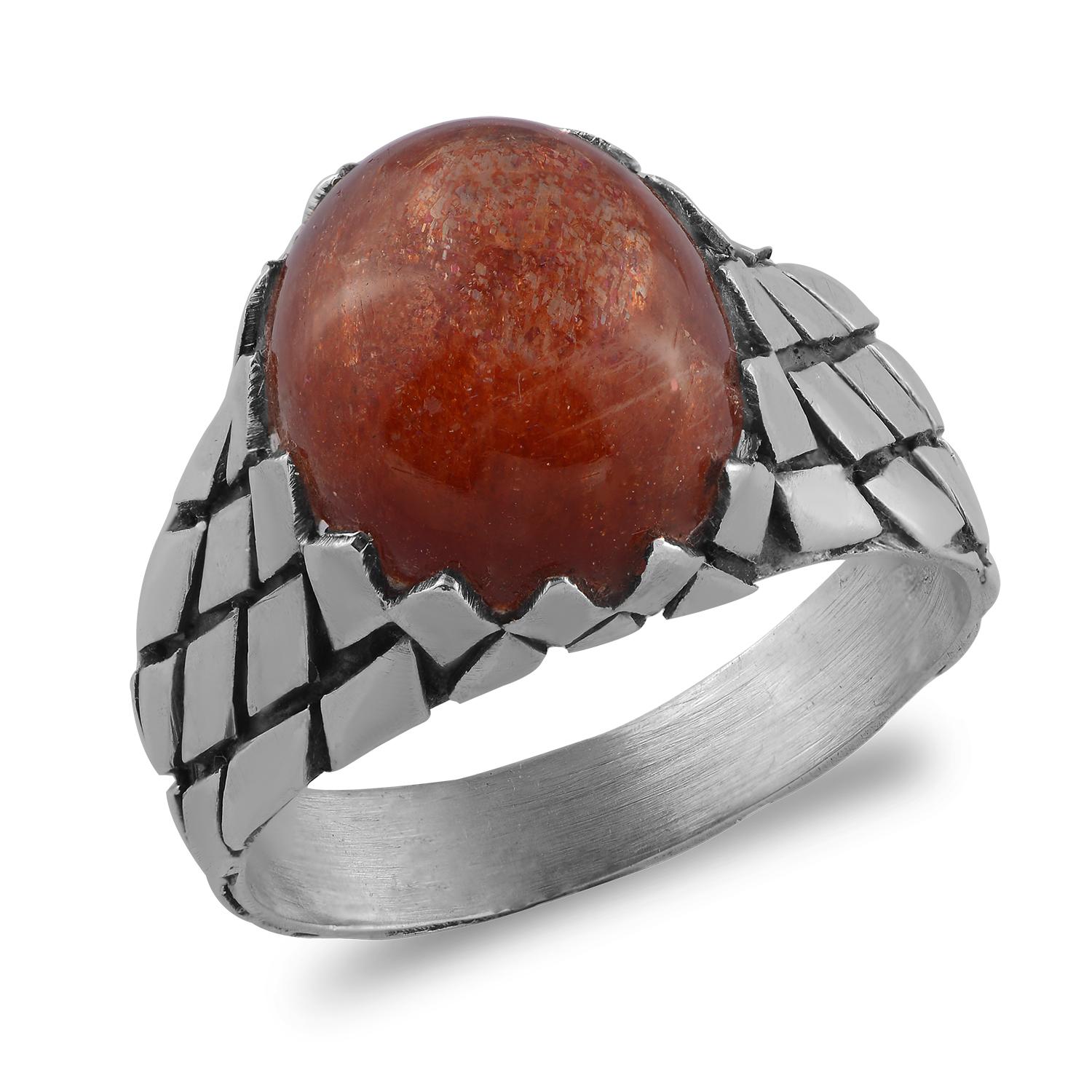 

In this striking one of a kind  Sunstone Man's Silver Ring, we have used a magical gemstone called sunstone, which glimmers and creates iridescence  when viewed from different angles. It has a been set in oxidized silver with patterning on it. The