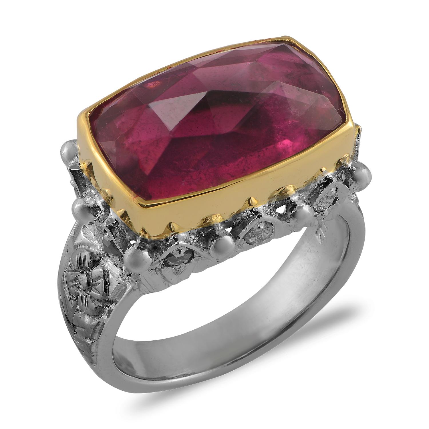 

This divine one of a kind Tourmaline Diamond 18 Karat Gold Cocktail Ring,  has been handmade in our workshops. It features a 12.35ct pink tourmaline, surrounded by rose cut diamonds. The tourmaline is set in 18 karat gold and the shank is made in