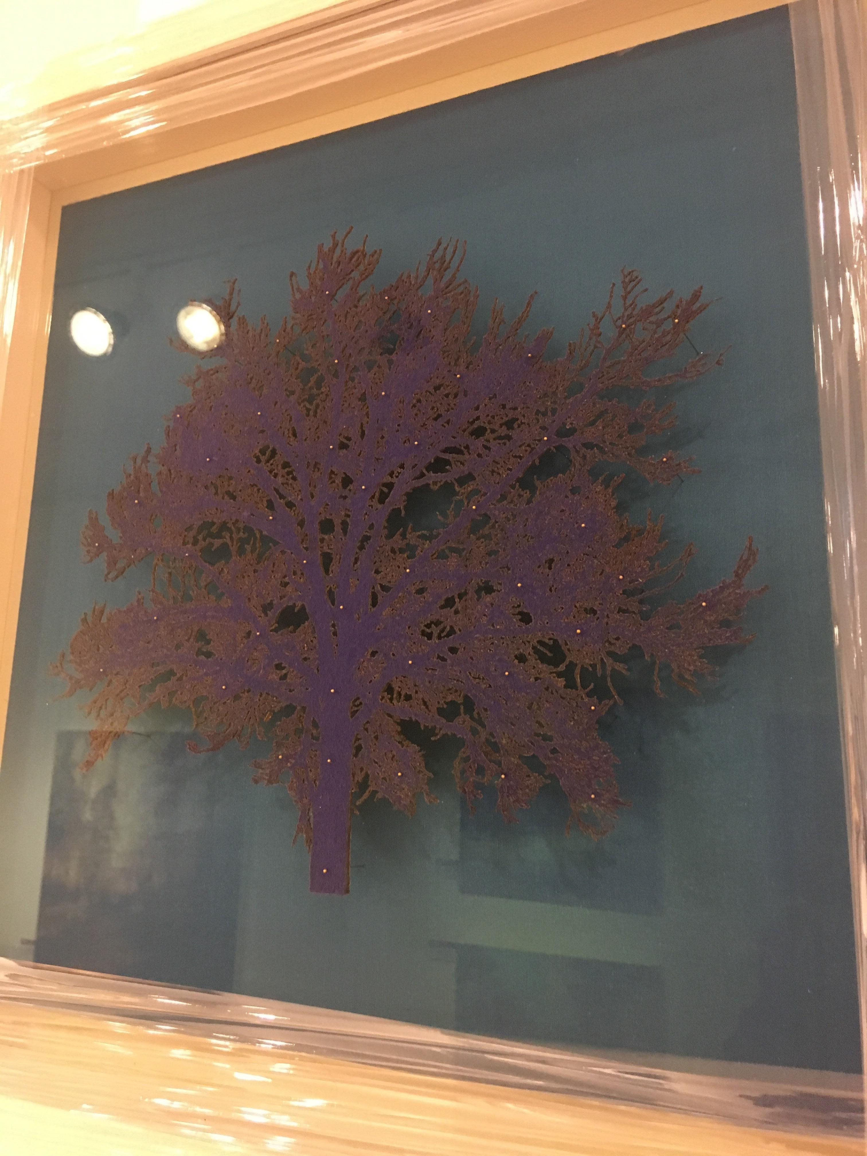 Emma delicately cuts images, especially trees, from a medium like felt or paper and pins them minutely to their chosen background, raised ethereally from the surface, forming beautiful shadows and layers.

‘’Colour, texture and light all inspire,