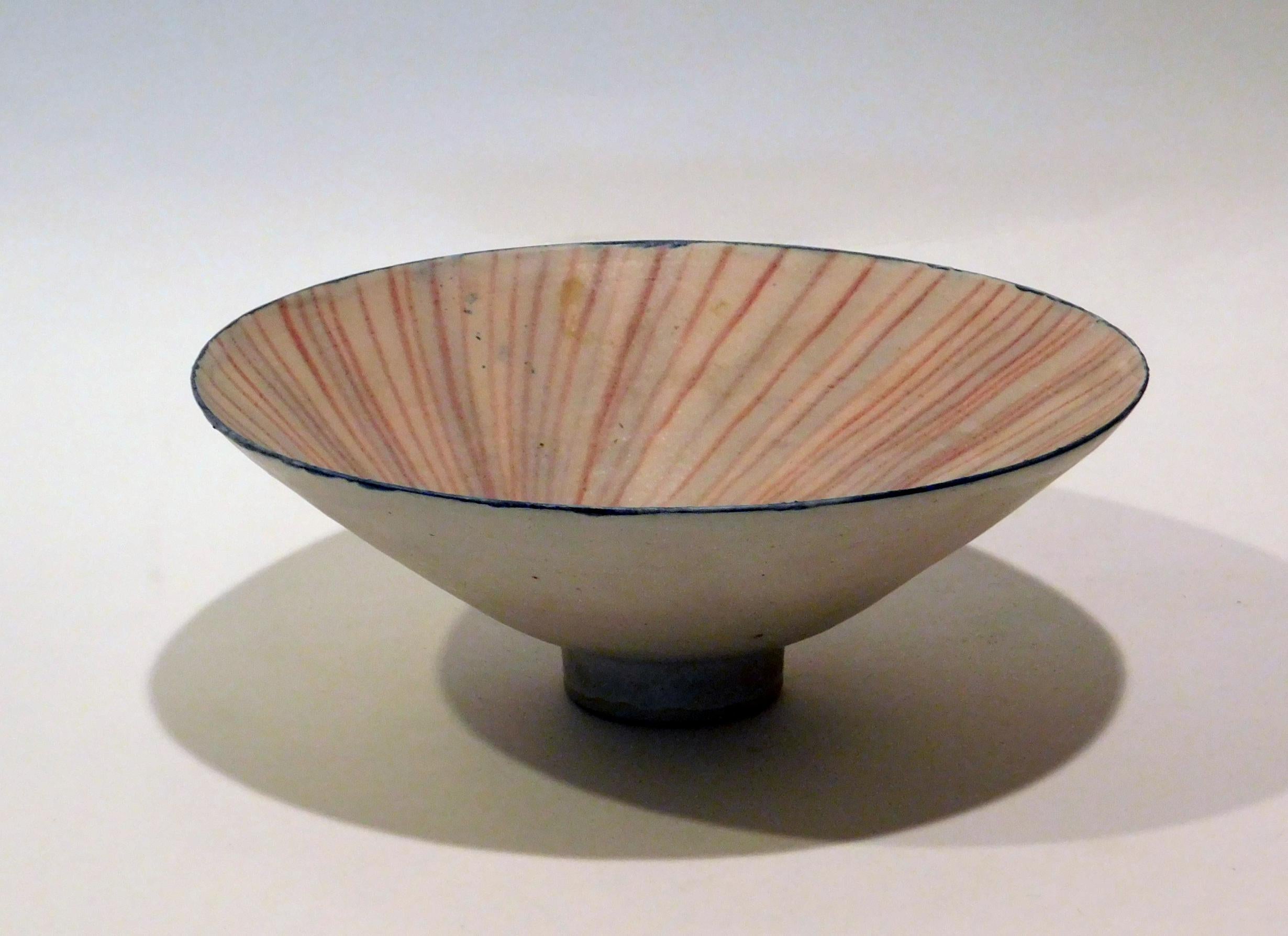 Emmanuel Cooper (1938 - 2012) UK Ceramist - flared footed studio bowl.
The interior is decorated with an alternating pink and blue pinwheel design.
Excellent condition. The EC mark is seen on the bottom.
Measures: height: 3 5/8 inches. Diameter: