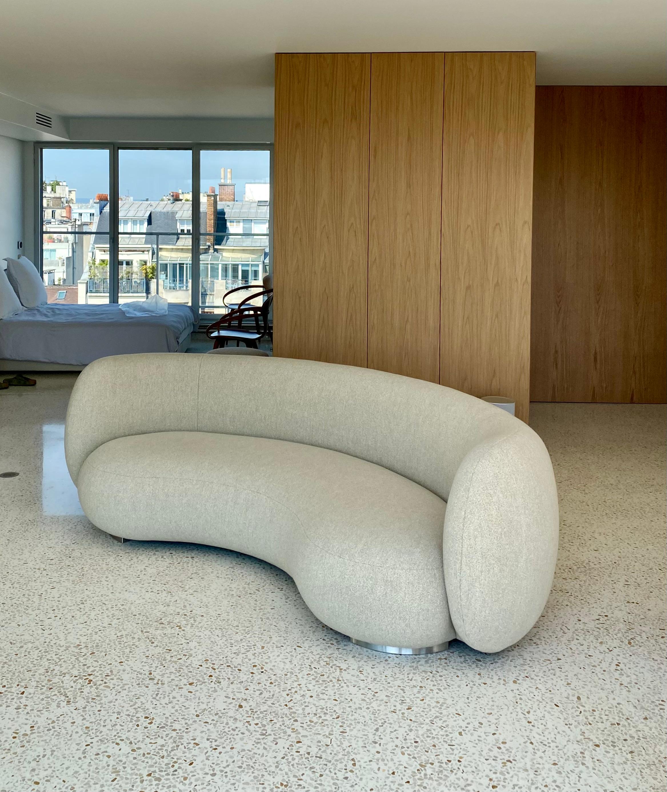 The EOS-1 sofa is meticulously handmade to order in France by our upholsterer, following traditional techniques highlighting artisanal quality and attention to detail. 
The version shown on the first two images is covered with a Holland & Sherry -