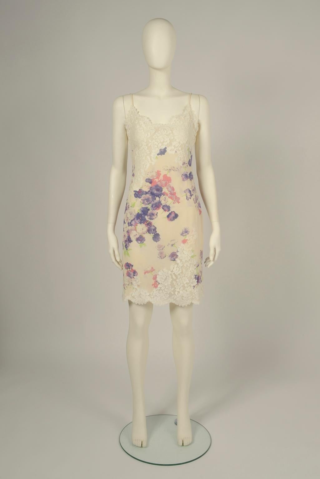 In line with the minimal slip styles of the 90s, this vintage Emanuel Ungaro (first line) mini dress is perfect for nearly any summer events. Made from refined silk patterned with blooms in a palette of pretty pastel tones, the slip dress is