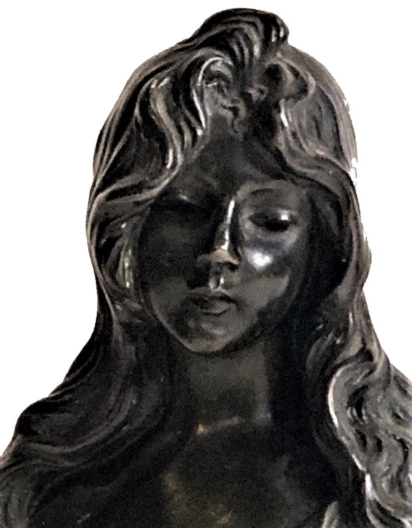 DETAILS 
Signed and foundry mark on back.

DIMENSIONS 
Height: 4-15/16 inches 
Width: 2-5/16 inches 
Depth: 2.25 inches

ABOUT THE SCULPTURE
This portrait bust is of Nelly Faner, famous burlesque dancer at the turn of the XX Century