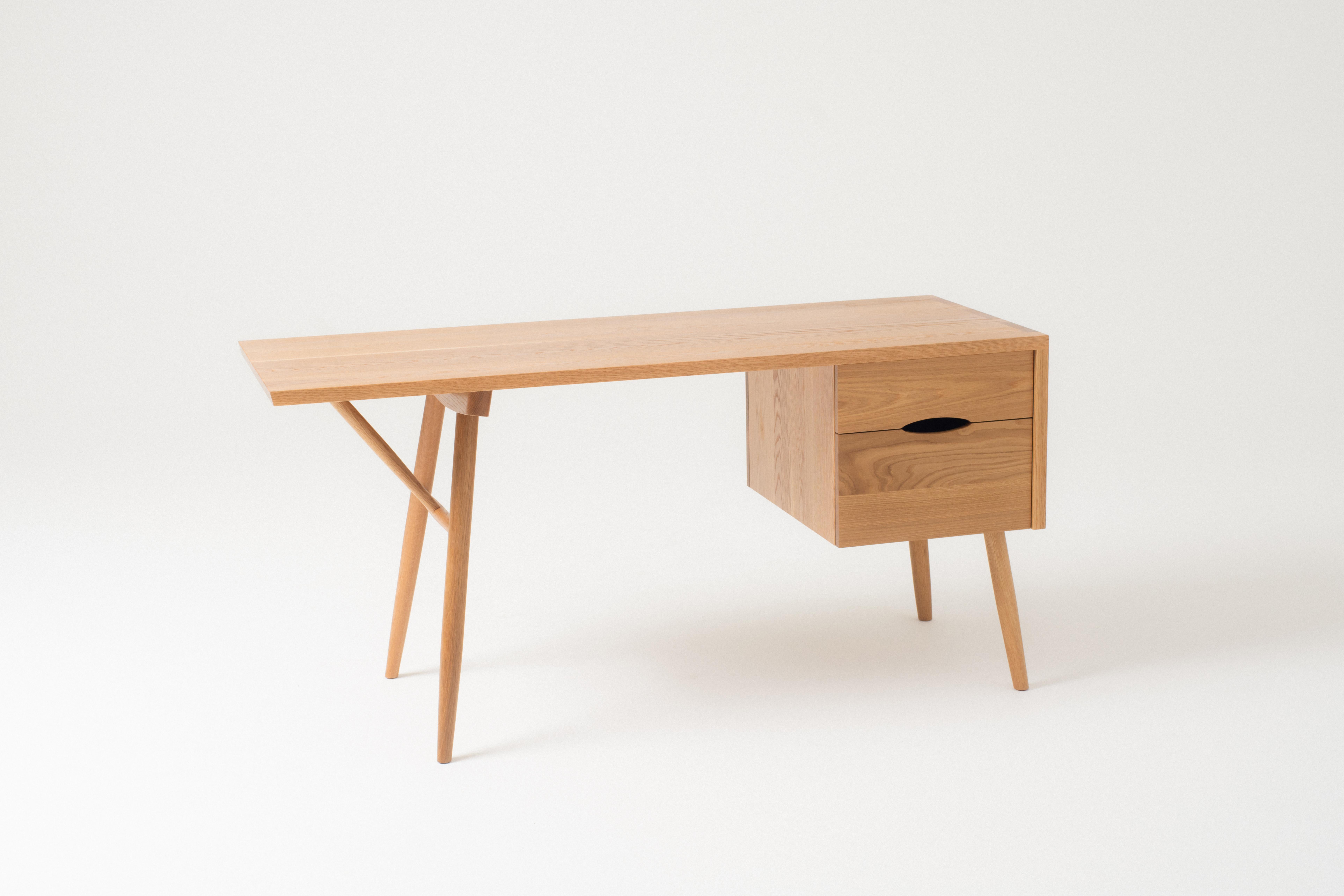 The Emmett Desk is a simple asymmetrical desk with exposed offset box joints and turned tapered legs. Spread your papers out, pile your books in a corner, open the laptop, draw for hours, put your feet up, hold yourself steady against the workday or