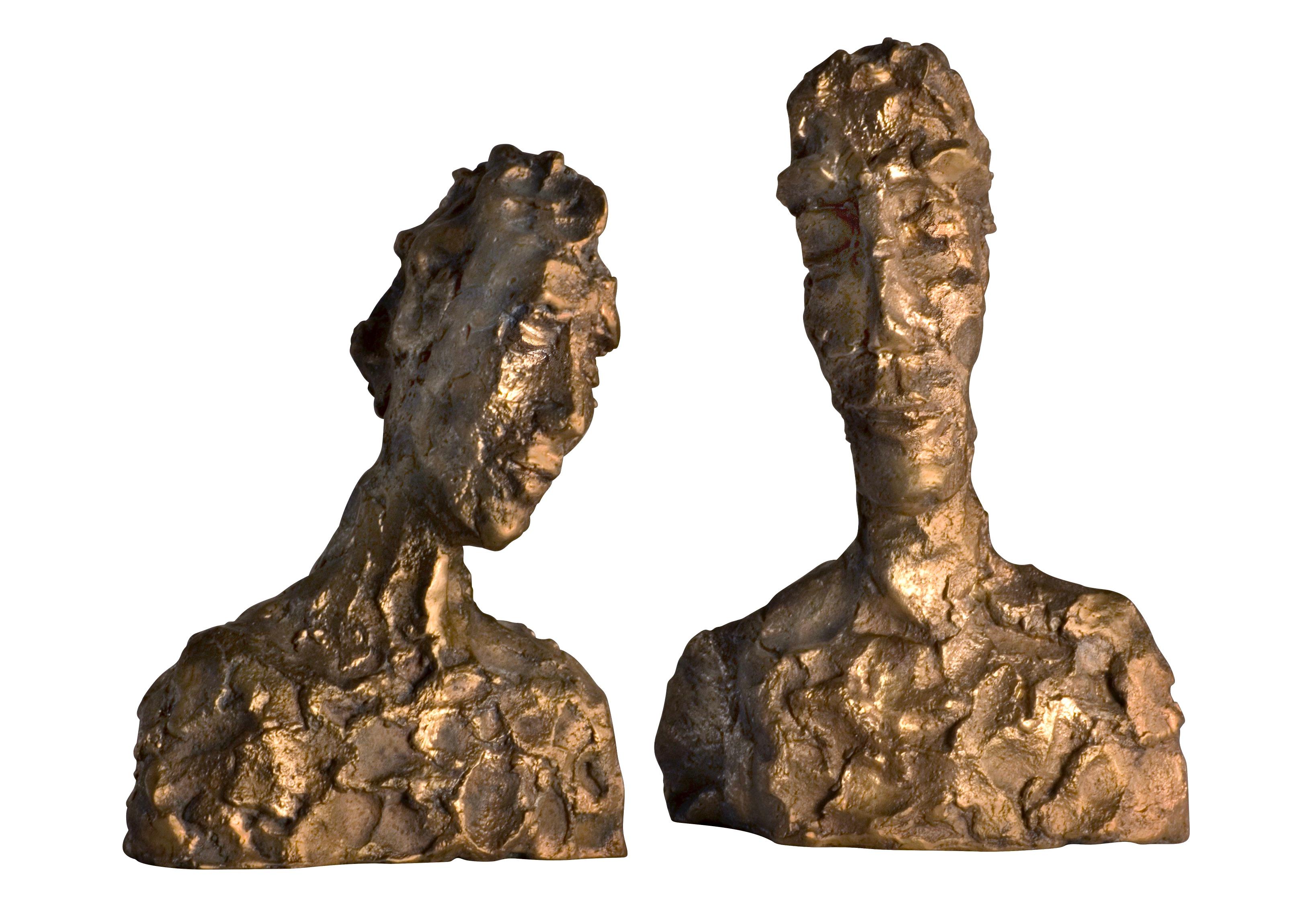 This raw bronze sculpture has a natural golden brass finish. The female and male Giacometti-influenced portraits are individual objects and can be positioned in various combinations to achieve a unique perspective. Placed facing one another - a