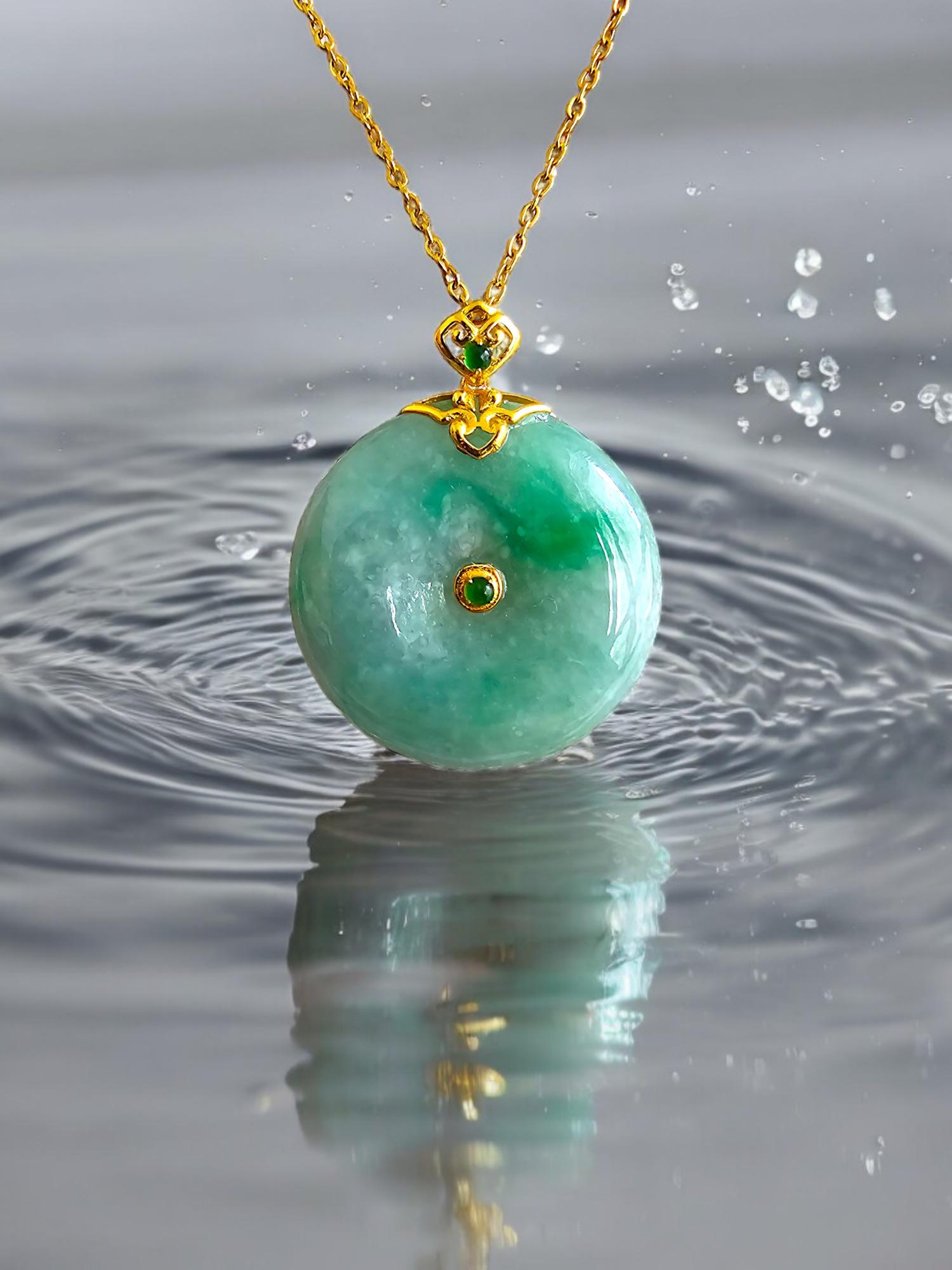 Certified Emperor's Round Burmese Green A-Jade Jadeite 24mm Donut Pendant (with 18K Solid Yellow Gold) 

The Emperor's Round Burmese A-Jadeite Pendant is a distinctly FYORO design, symbolizing the history of the orient.

Limited to 88 pieces, to