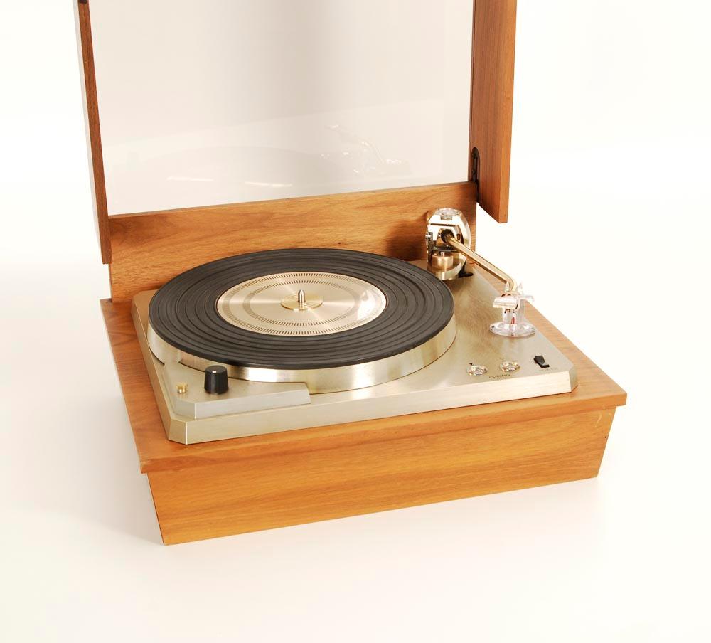 Empire 698 vintage record player with subchassis and belt drive engine. In wooden console. Great condition. 
The Empire company made extremely well made turntables, built to last a lifetime. The Empire 698 is a beautifully constructed and finished