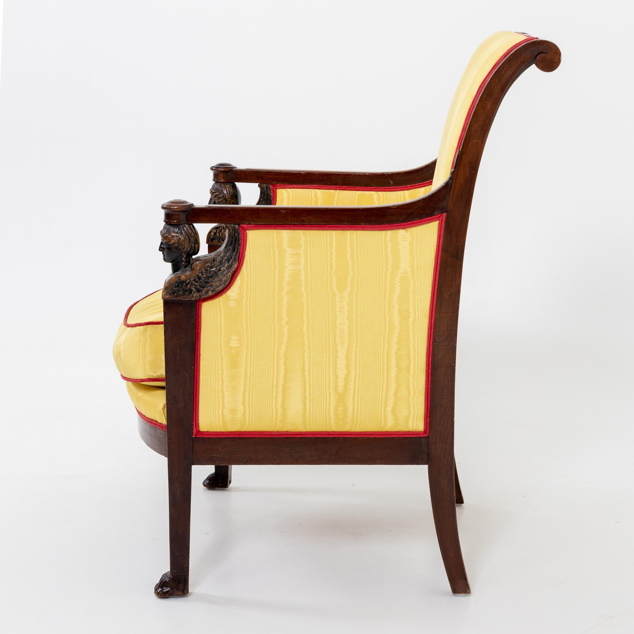 French Empire Armchair with winged Caryatids and yellow Silk Fabric, France circa 1800 For Sale