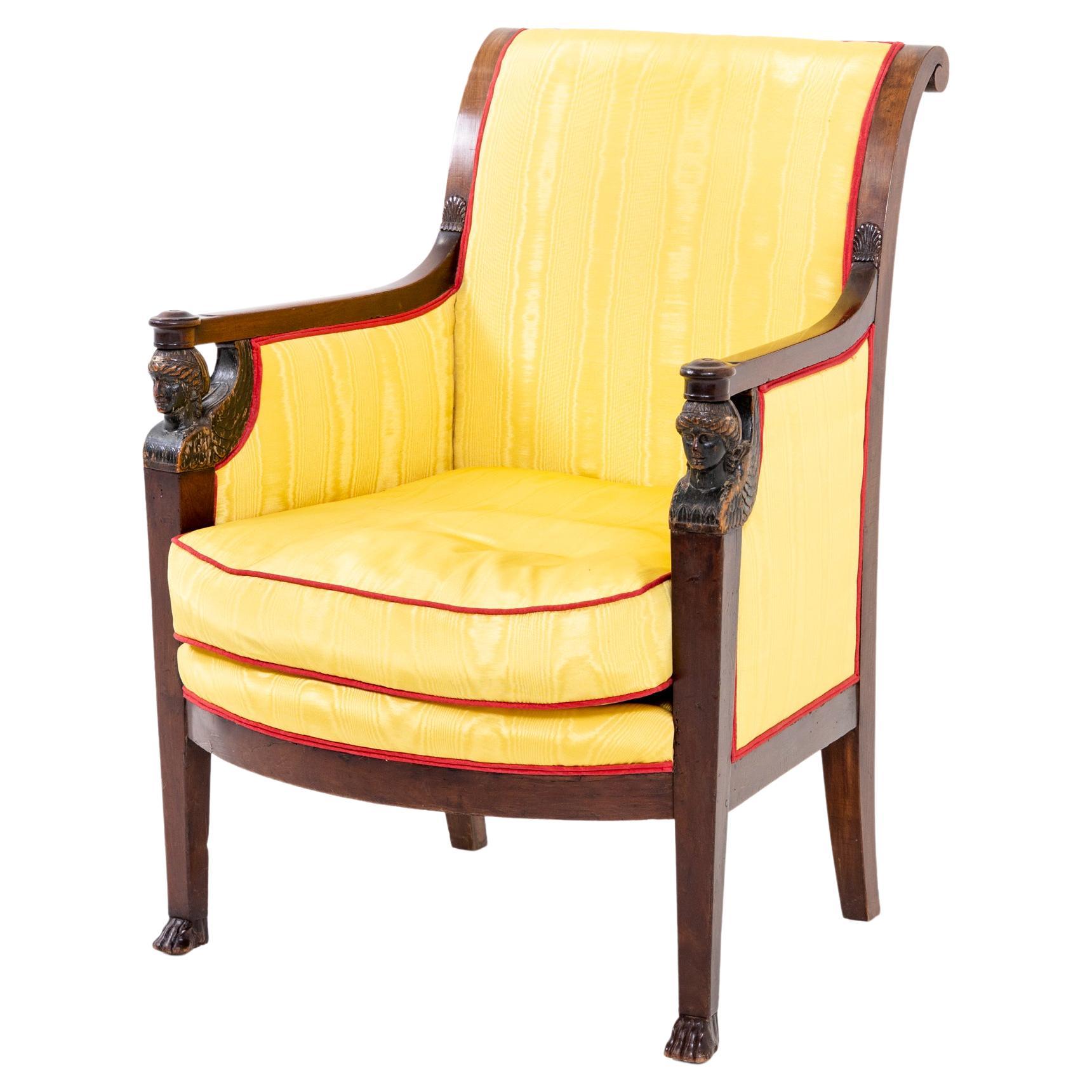 Empire Armchair with winged Caryatids and yellow Silk Fabric, France circa 1800 For Sale