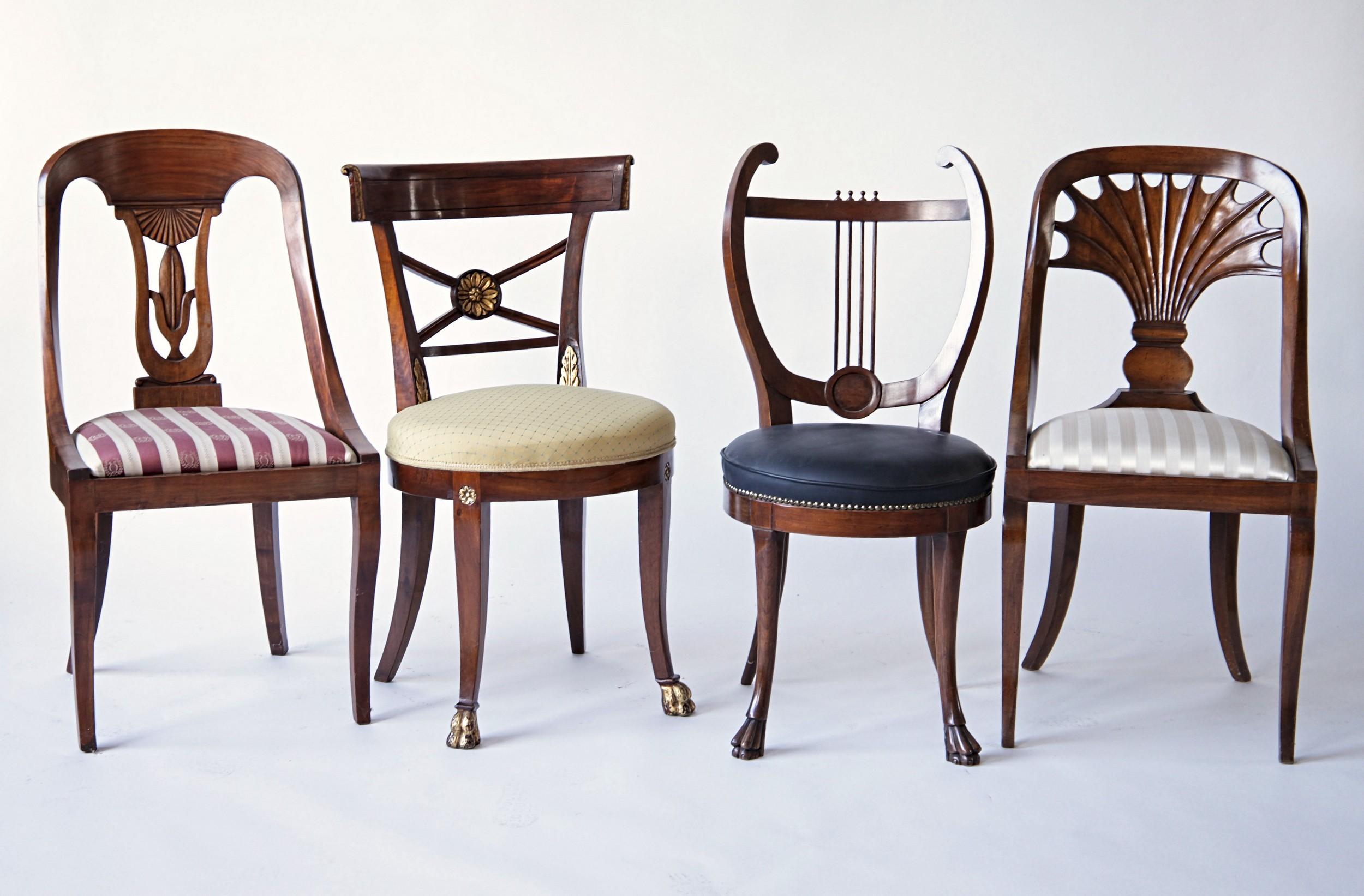 Empire set. Made of eight different style of chairs. The differentiation in stile and the shapes are each gorgeous.

An profusion of cherry, walnut wood and carvings, lion feet, lira shape, bas-relief details and on and on. Just take a look of