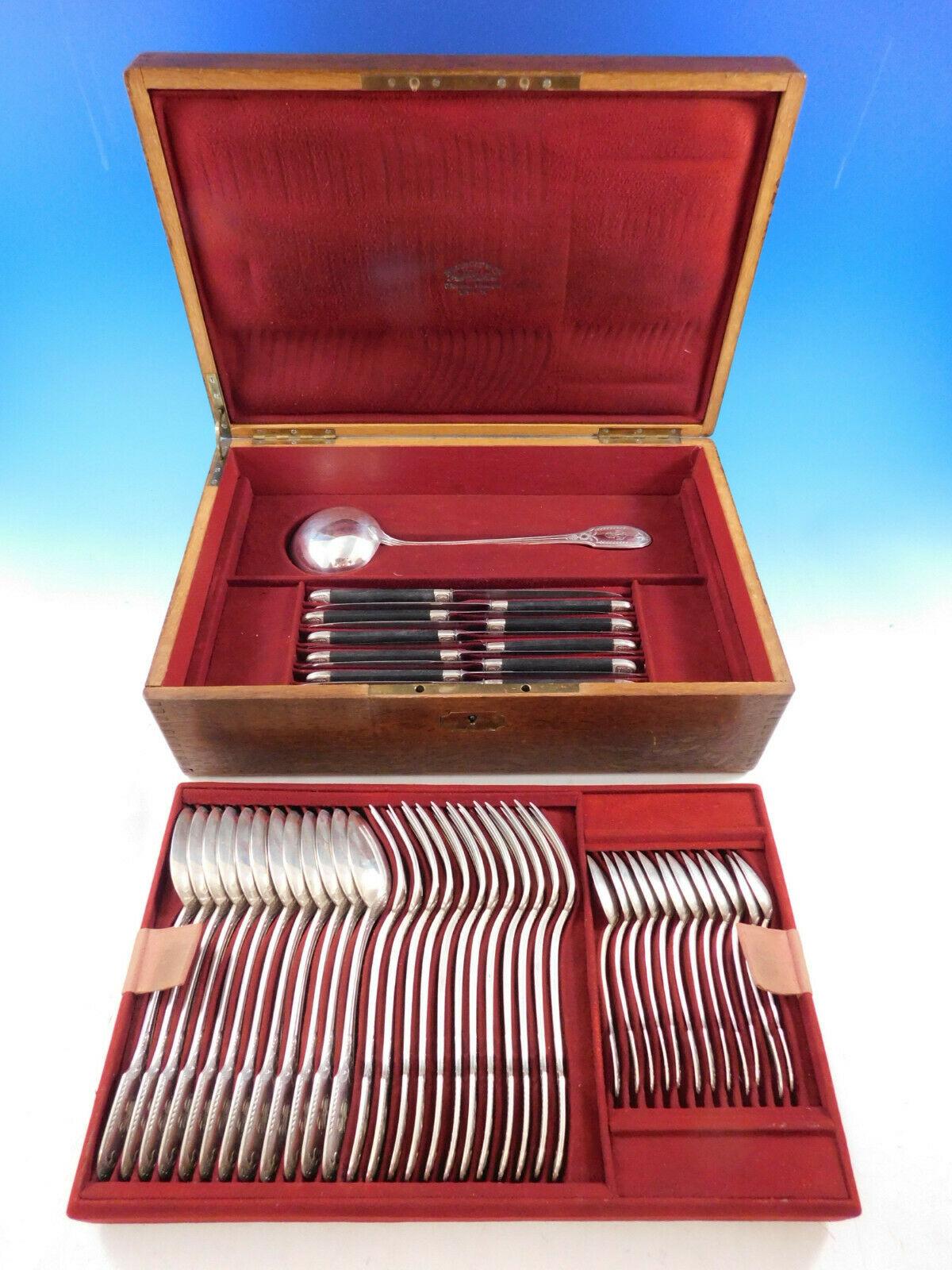 The Parisian silversmith Puiforcat is regarded as one of the legendary names in European silver craftsmanship. 
Superb Empire by Puiforcat sterling silver flatware set, 49 pieces in fitted chest. This rare pattern features an elegant swan motif.